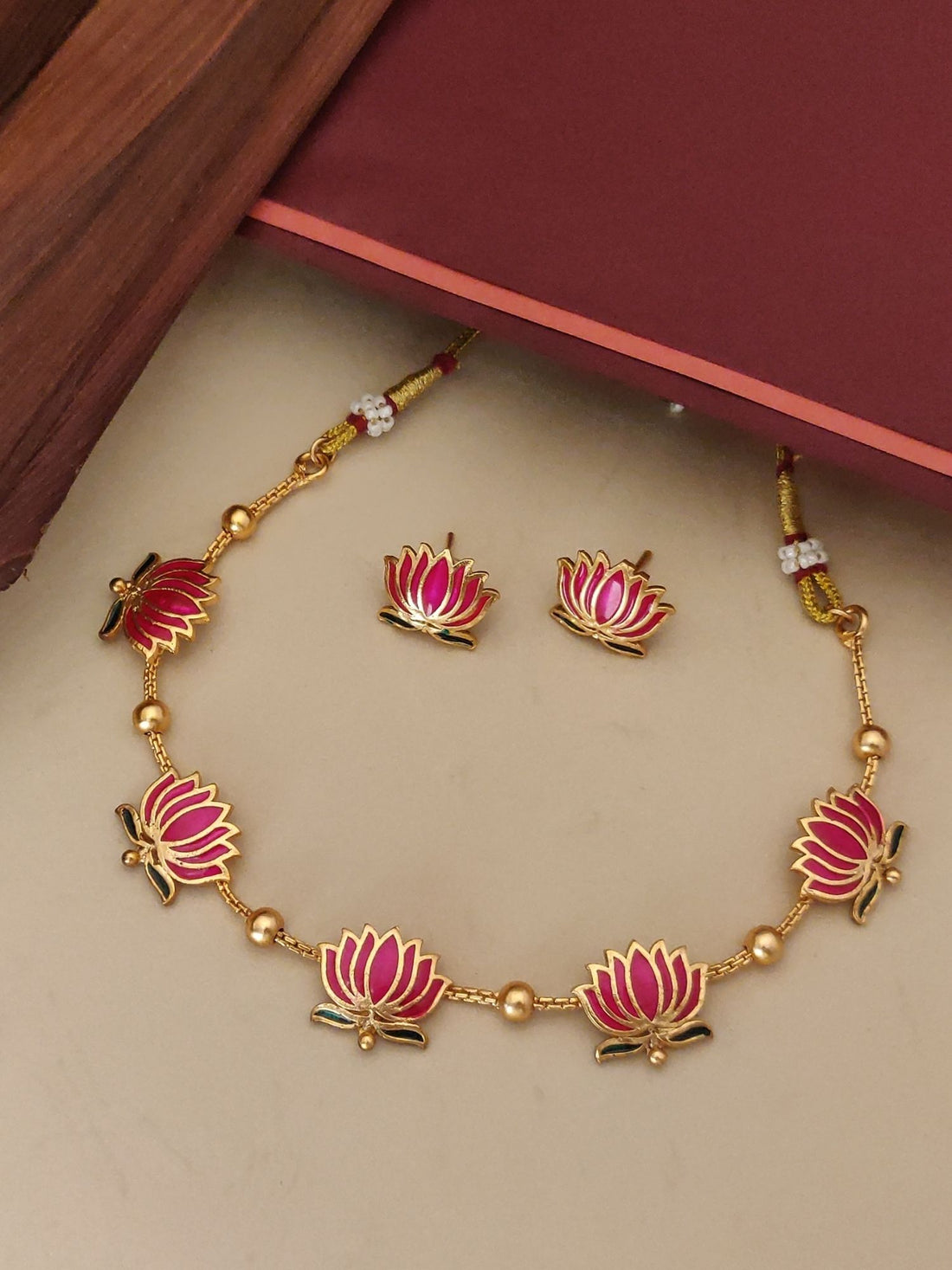 Abdesignsjewellery gold plated lotus necklace set with pink enamel lotus charms and matching stud earrings