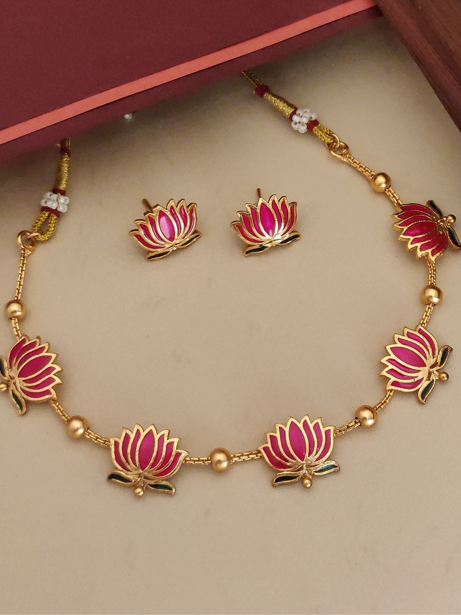 Abdesignsjewellery gold plated lotus necklace set with pink enamel lotus motifs and matching stud earrings