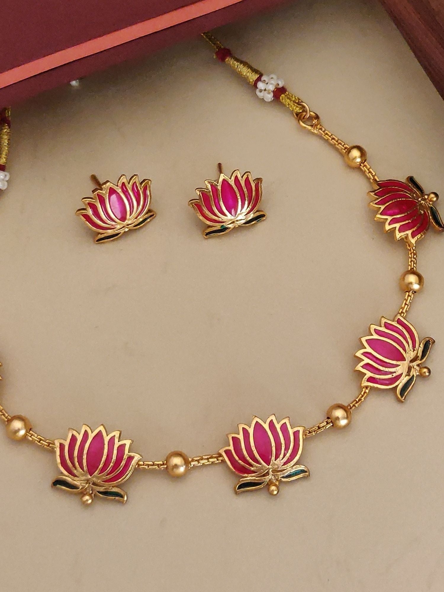 Abdesignsjewellery gold plated lotus necklace set with pink enamel lotus charms and stud earrings