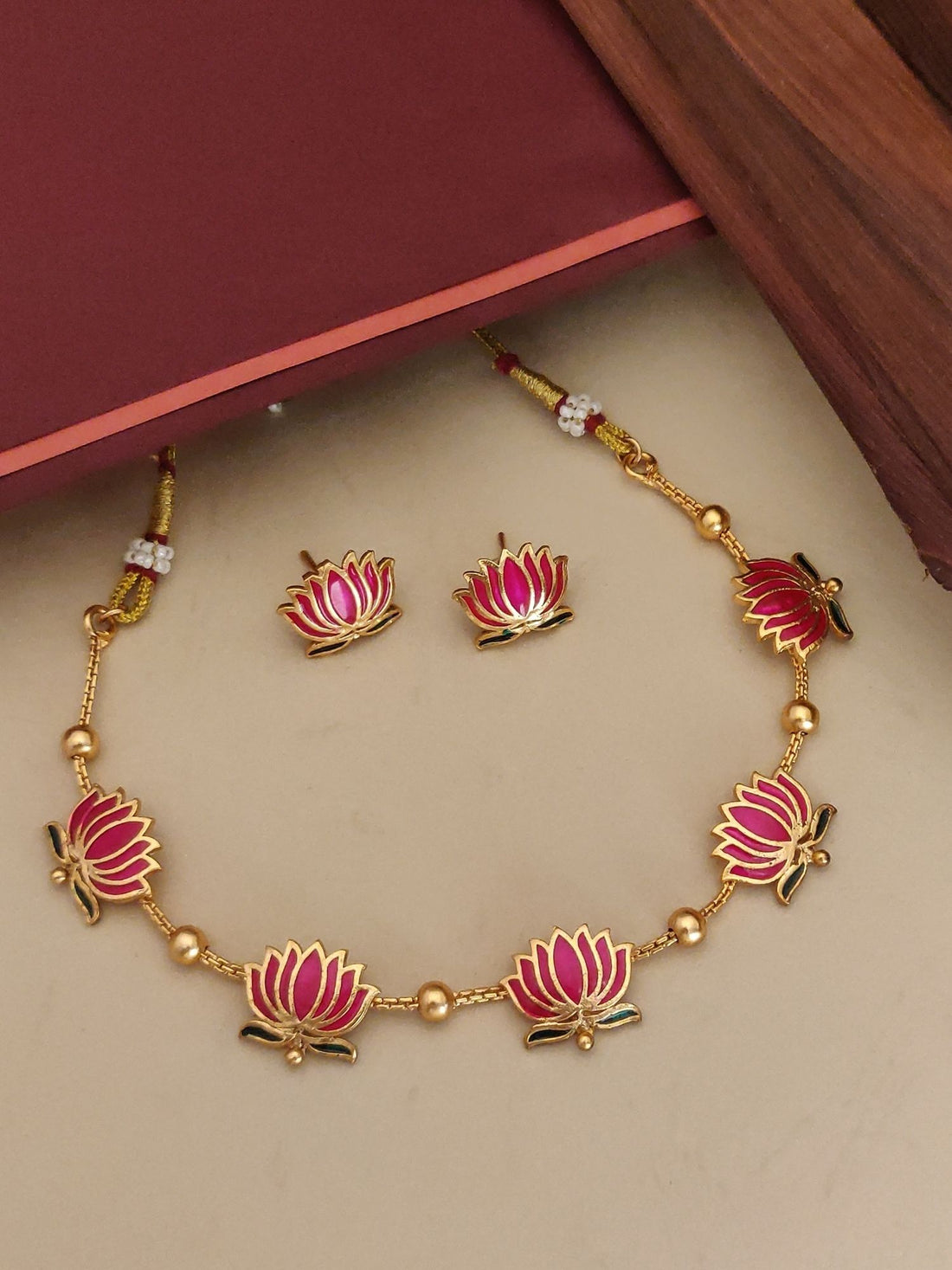 Abdesignsjewellery gold plated lotus necklace set with pink enamel lotus charms and matching stud earrings