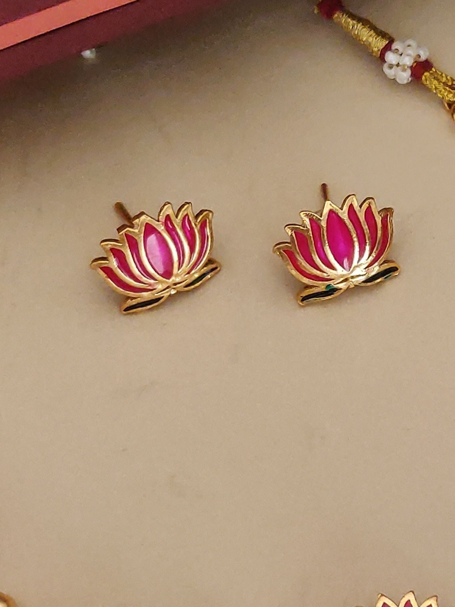 Abdesignsjewellery gold plated lotus necklace set showing pink enamel lotus stud earrings with gold outline