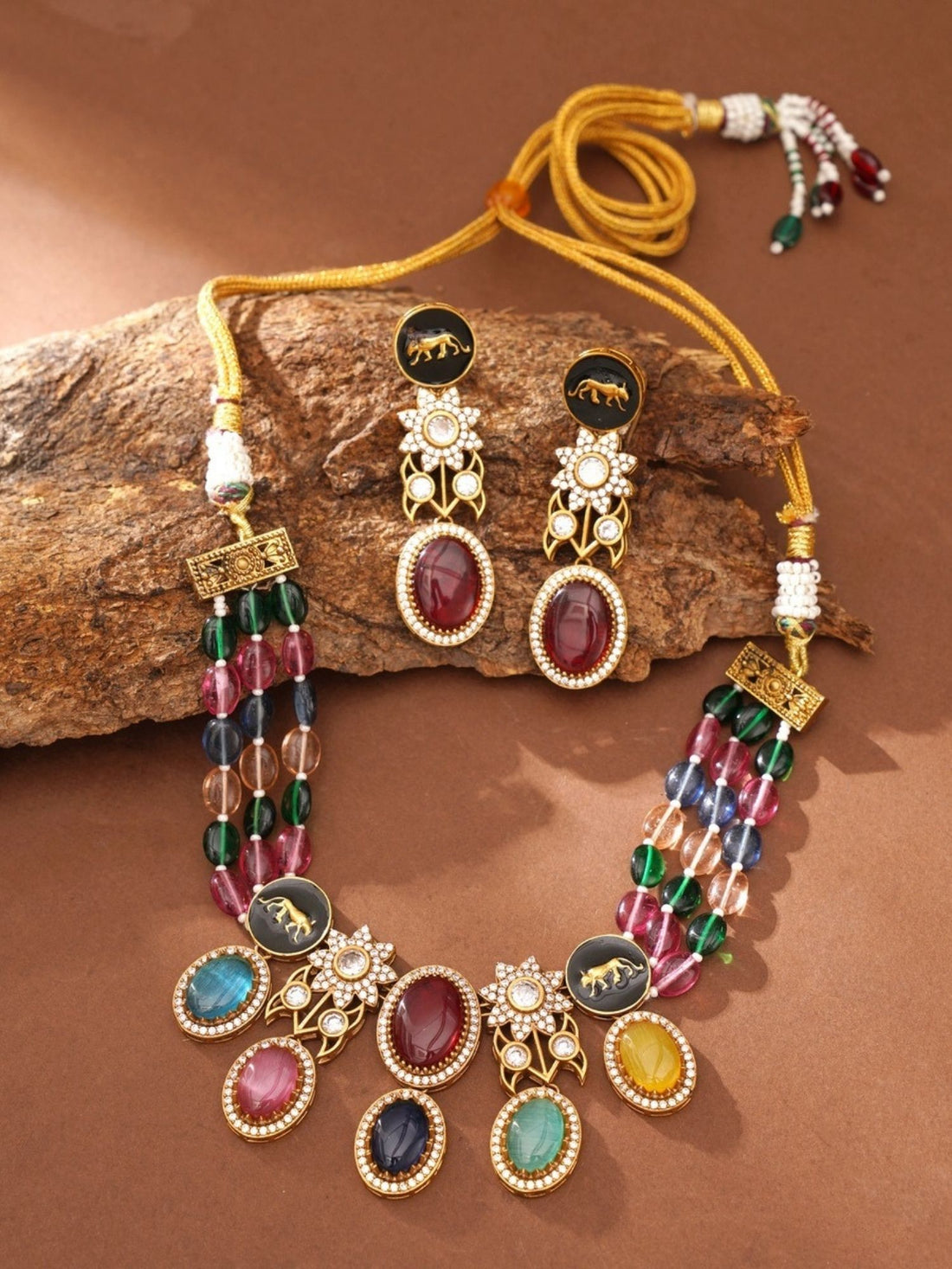 Abdesignsjewellery model wearing gold plated multicolour beads necklace set with colorful gemstone pendants and floral motifs