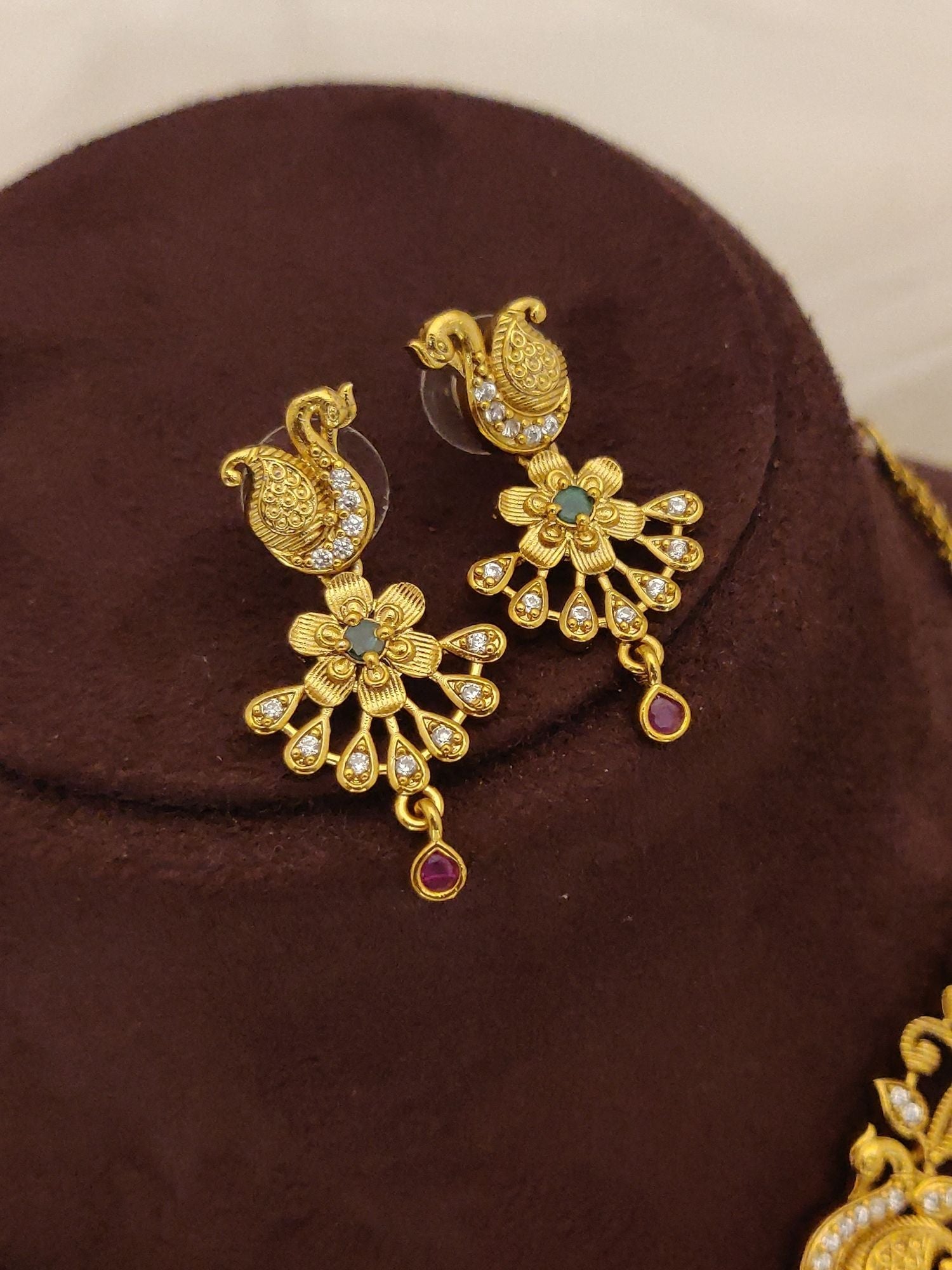 Abdesignsjewellery Gold Plated Peacock Necklace Set featuring intricate peacock pendant and matching floral earrings