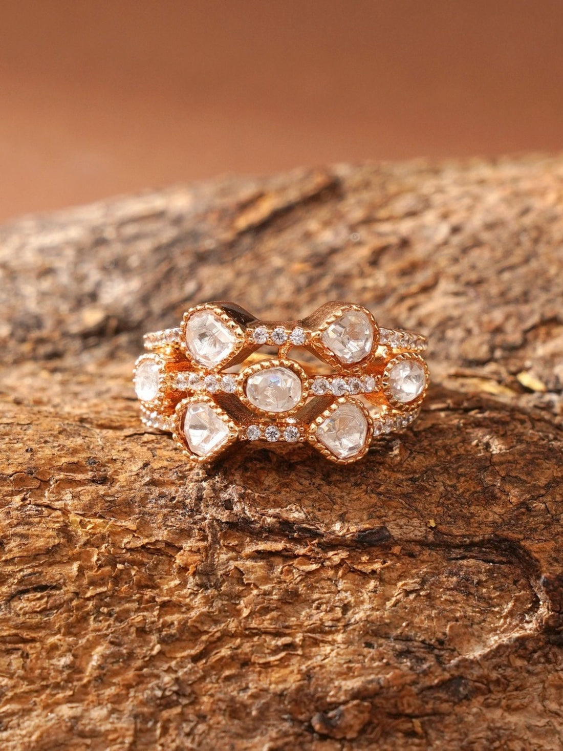 Close up of hand wearing Abdesignsjewellery gold plated polki kundan ring set with three stacked rings