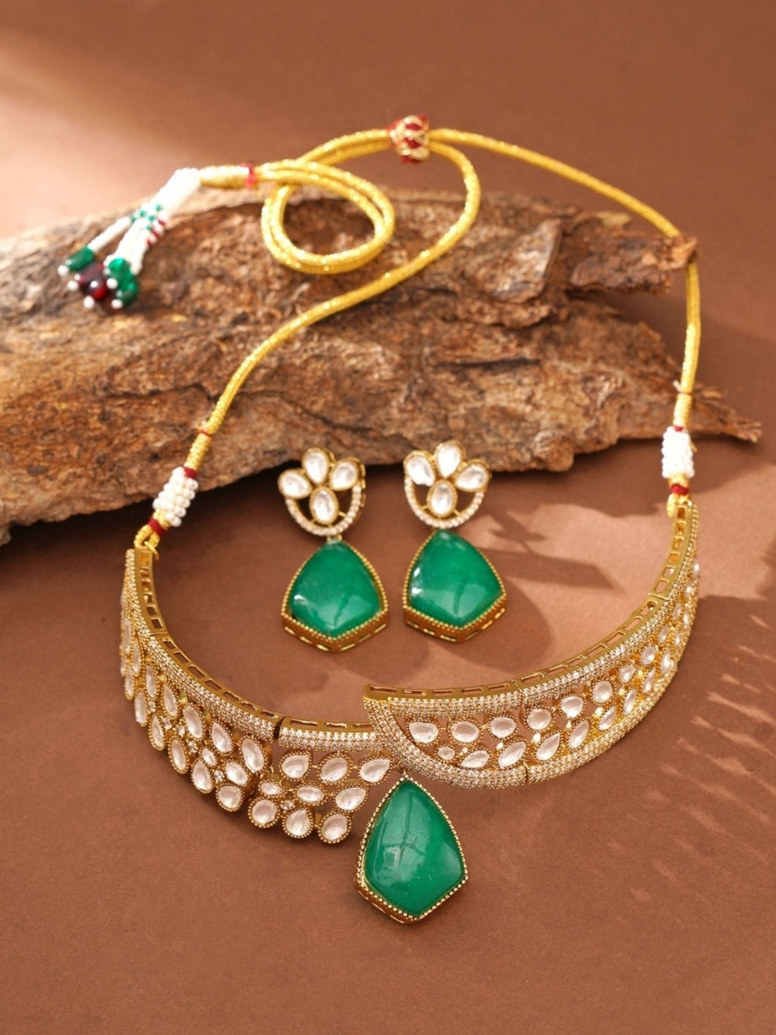 Abdesignsjewellery model wearing gold plated polki necklace set choker with green teardrop stone and matching earrings