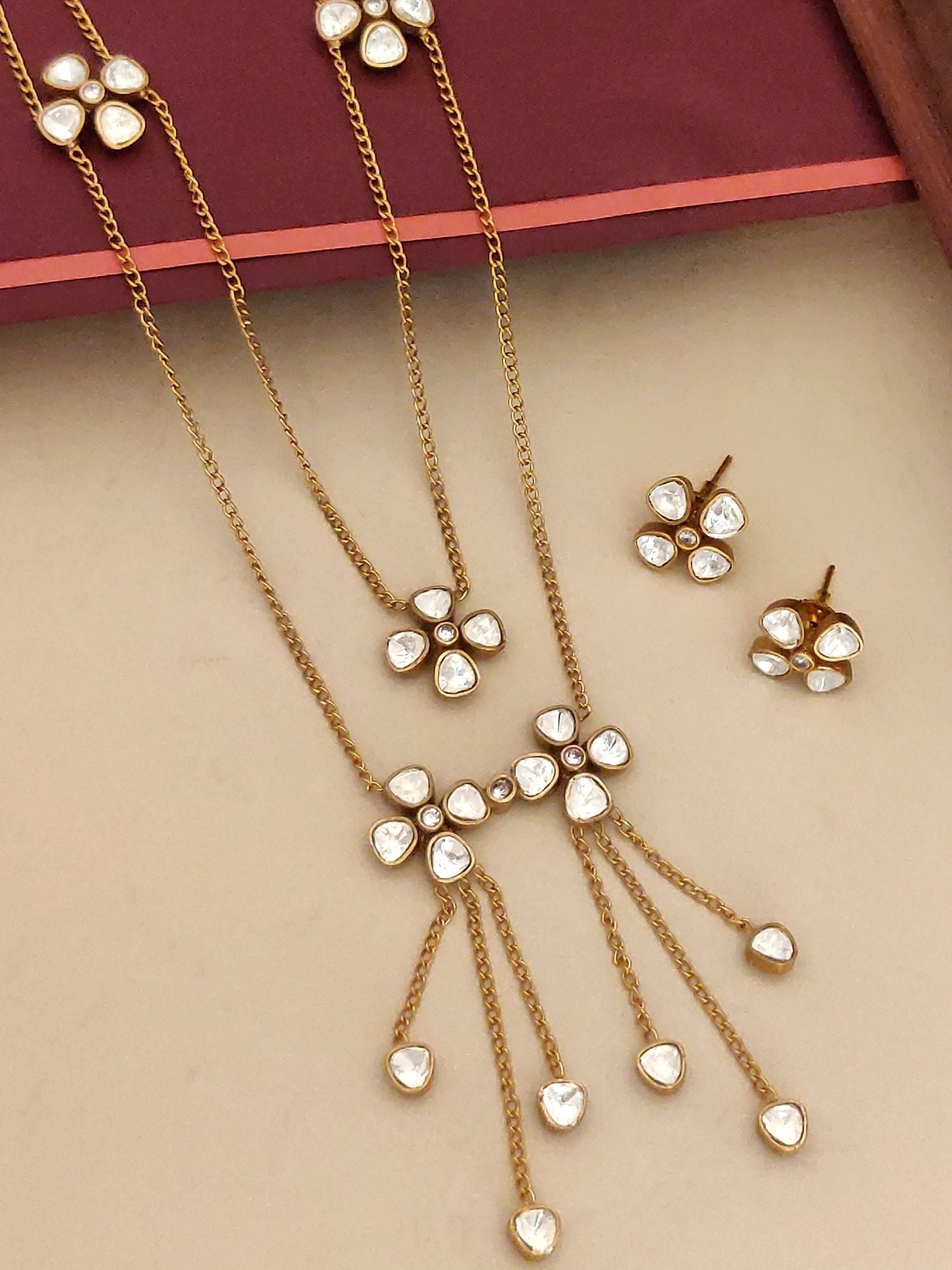 Abdesignsjewellery gold plated polki necklace set with floral motifs tassel chains and matching studs