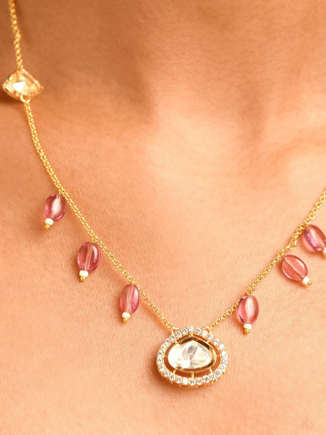 Model wearing Gold Plated Polki Pendant Chain With Earrings with teardrop pendant and matching polki studs