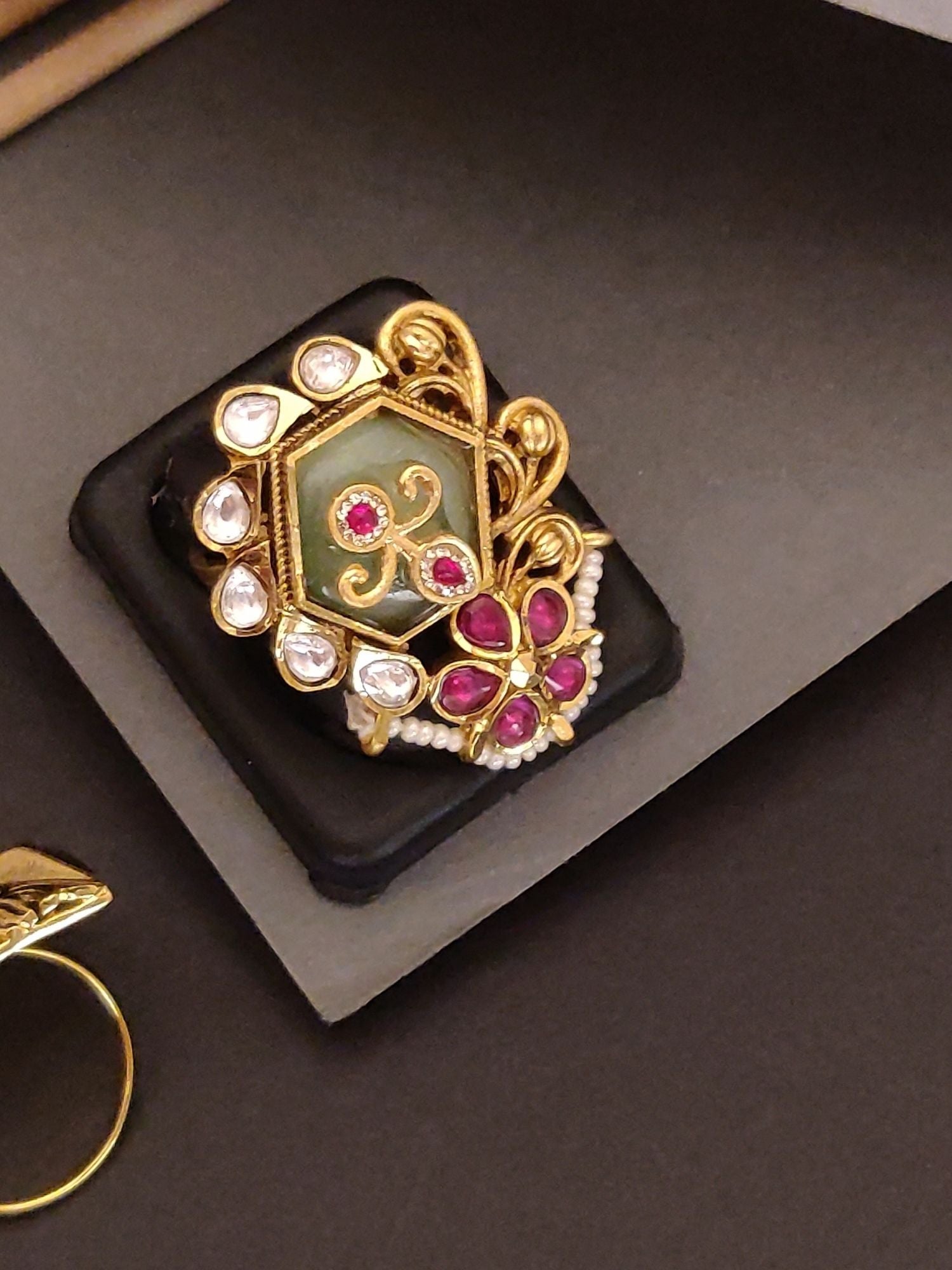 Abdesignsjewellery gold plated ruby kundan ring ornate floral design with green enamel kundan teardrops and pearl accents