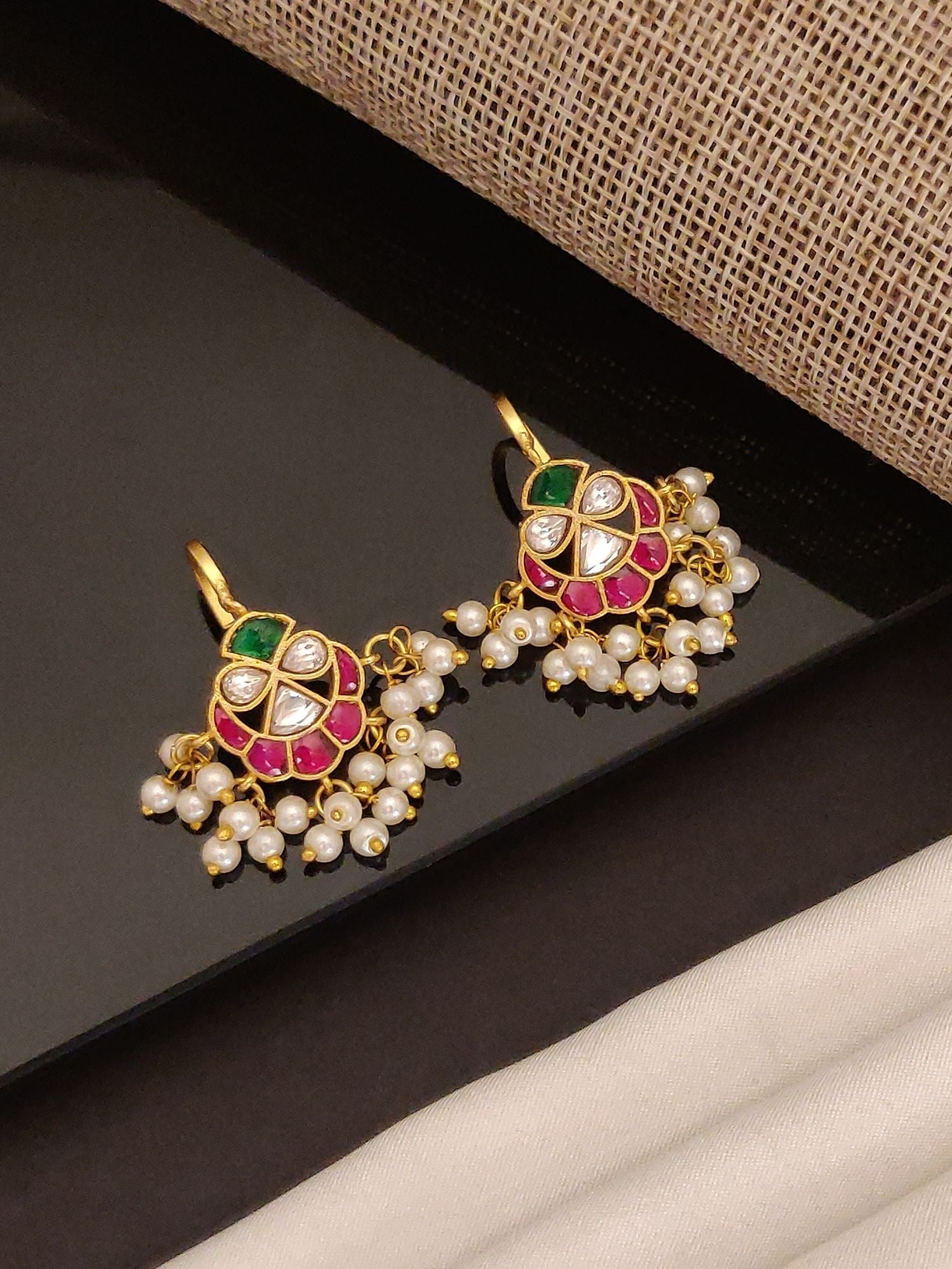 Pair of gold tone pearl stone earrings with pink and green enamel floral design and dangling pearls