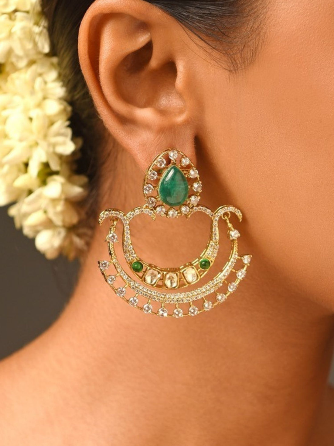 Abdesignsjewellery gold chandelier earrings with teardrop green stone and crystals on model green stone earrings for women