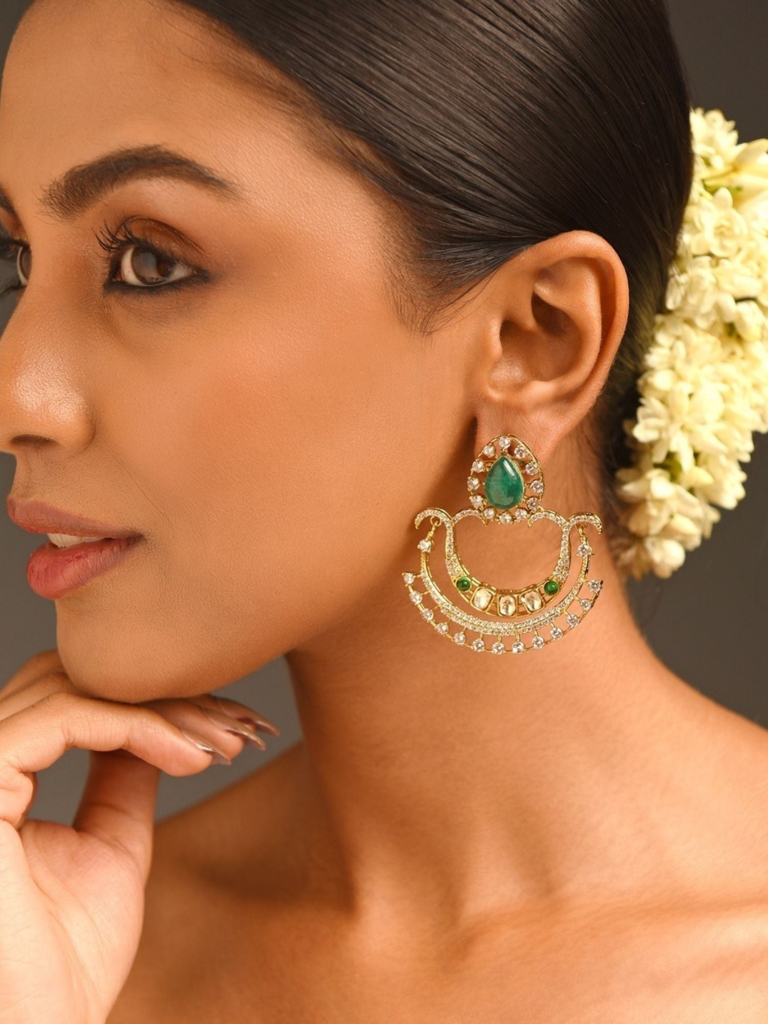 Abdesignsjewellery gold chandelier earrings with teardrop green stone and crystals on model green stone earrings for women