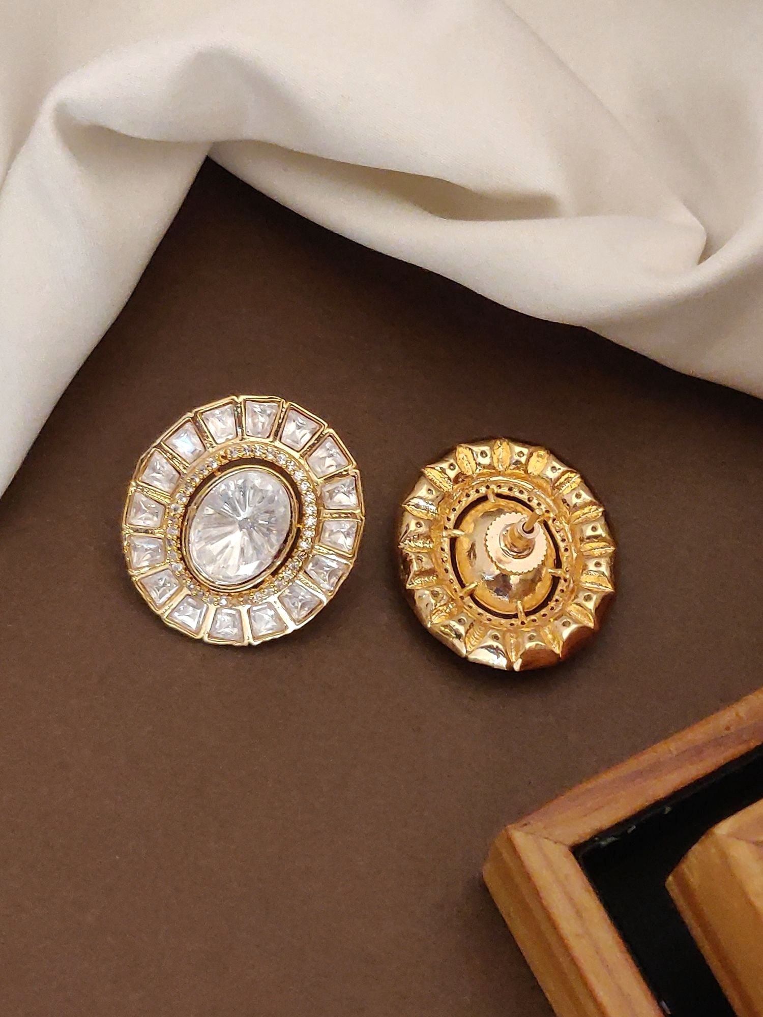 High Quality Gold Plated Polki Studs Earring pair of round gold plated polki studs with central oval stone and halo square stones