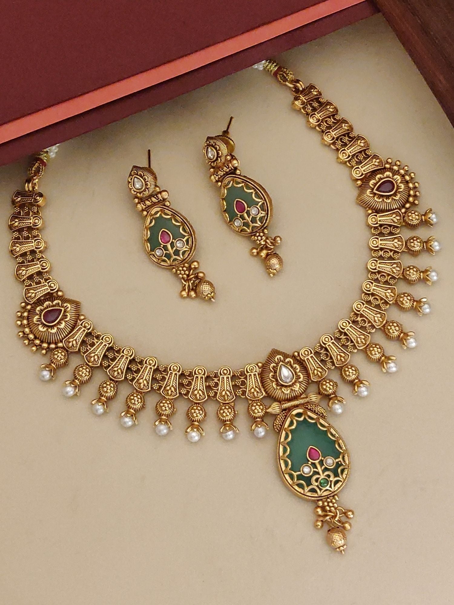 Imitation Necklace Set with Earrings featuring intricate gold design and green accents