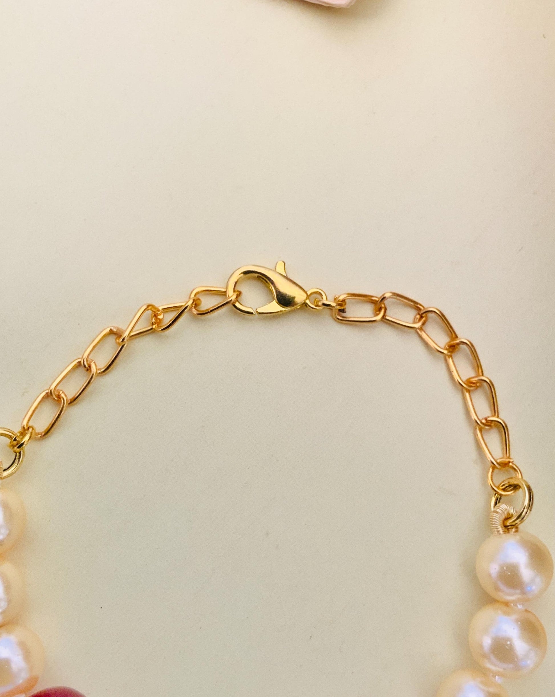 Close-up of gold chain clasp on Jaipuri Beads Hand Bracelet by Abdesignsjewellery