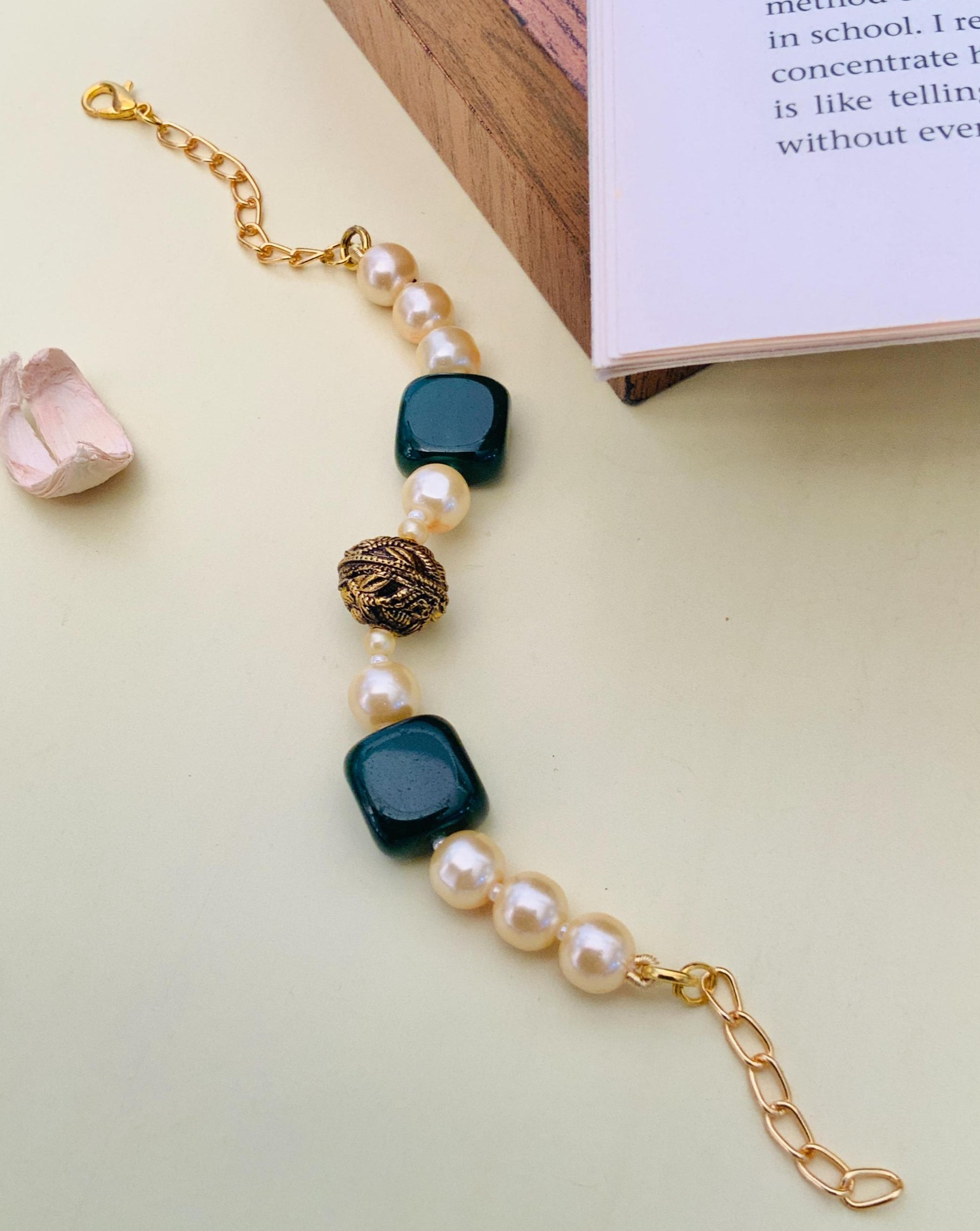 Jaipuri Beads Hand Bracelet by Abdesignsjewellery with pearl beads and decorative black and gold accents