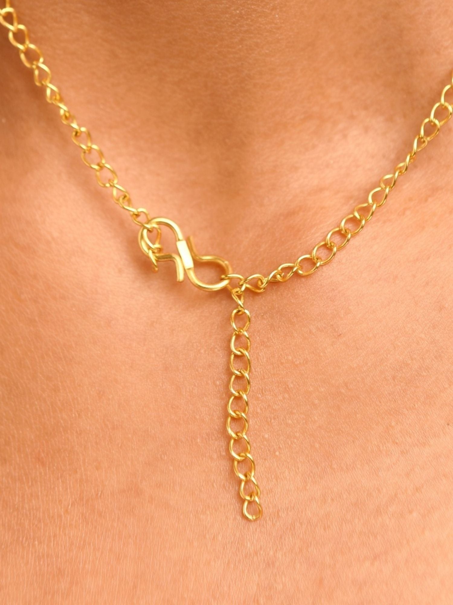Close-up of Abdesigns Jewellery Elegant Gold-Tone Necklace Set chain and clasp on skin