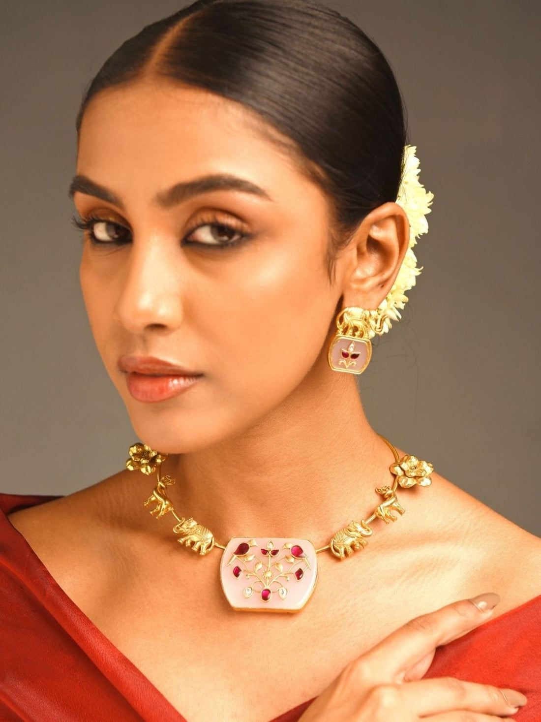 Abdesigns Jewellery Elegant Gold-Tone Necklace Set worn by woman with red outfit and matching earrings