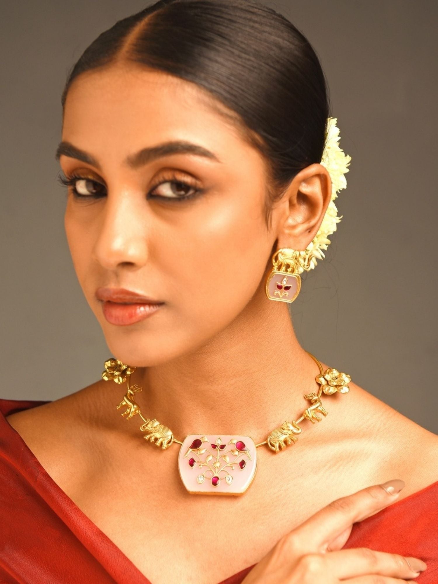 Abdesigns Jewellery Elegant Gold-Tone Necklace Set worn by woman with red outfit and matching earrings