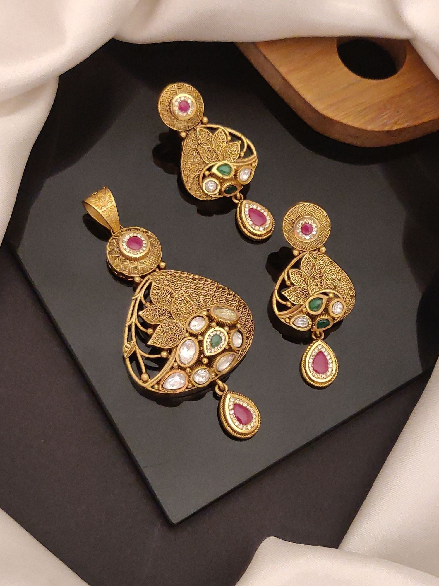 Abdesigns Jewellery Elegant Gold Tone Pendents Set with intricate leaf design and colorful stone accents