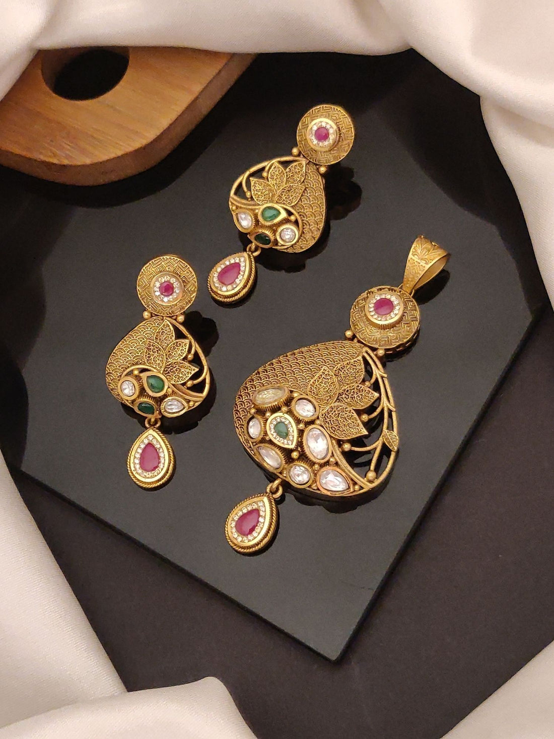 Abdesigns Jewellery Elegant Gold Tone Pendents Set with intricate leaf design and colorful stone accents