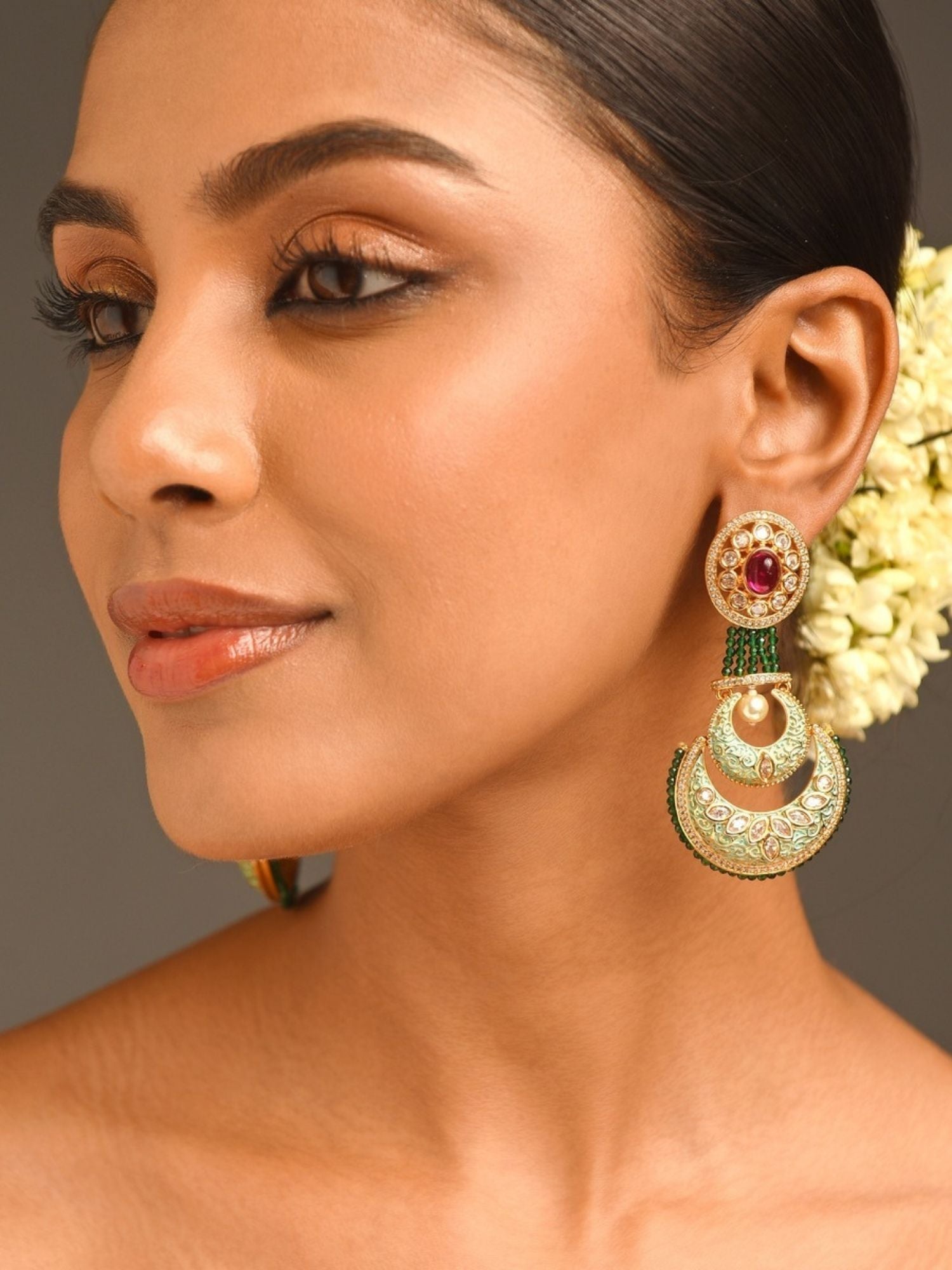Woman wearing Abdesigns Jewellery Elegant Green Ruby Earrings with intricate gold and green design