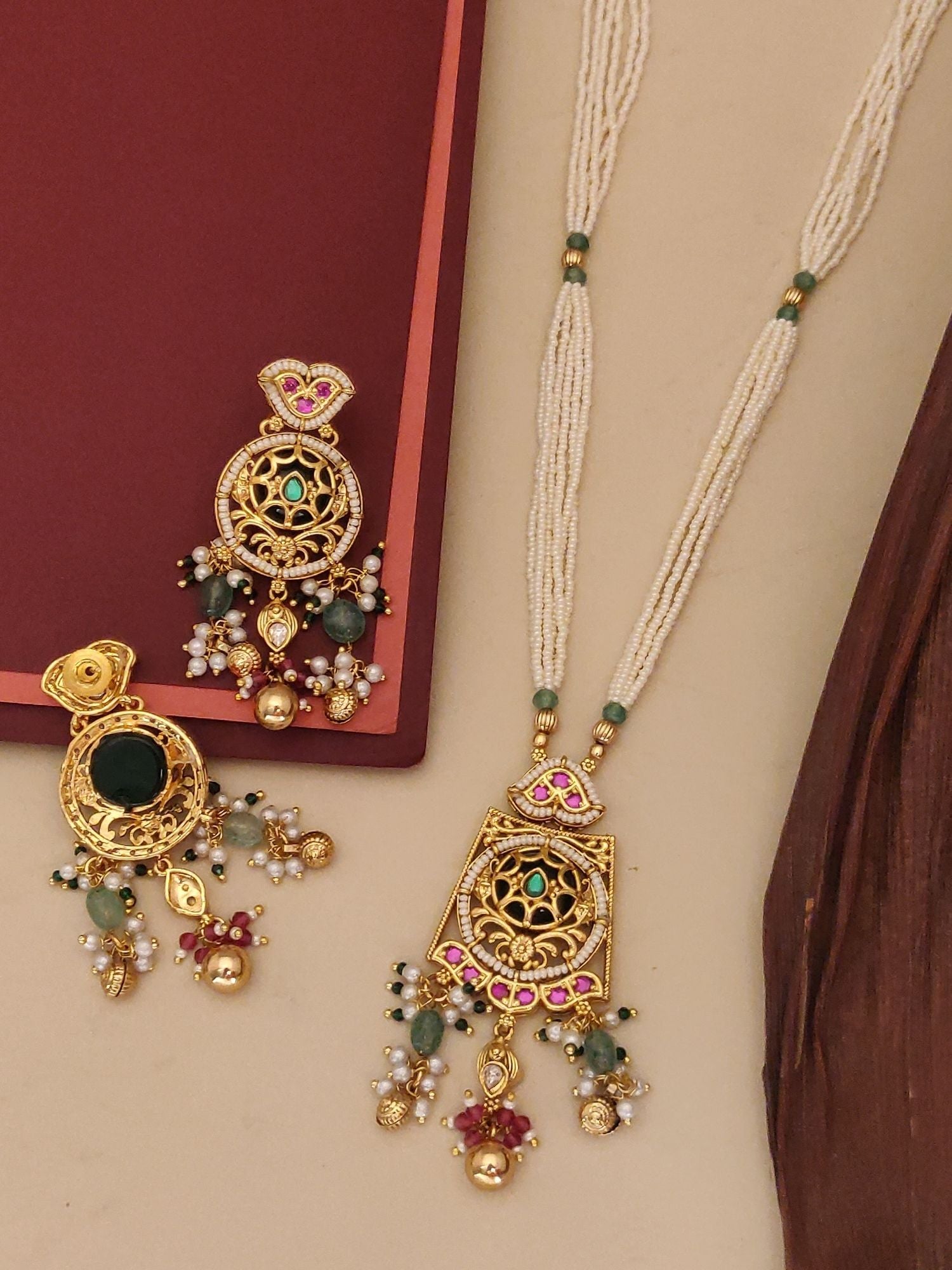 Abdesigns Jewellery Elegant Multi-Strand Pearl Necklace with gold and green embellished pendant and matching earrings