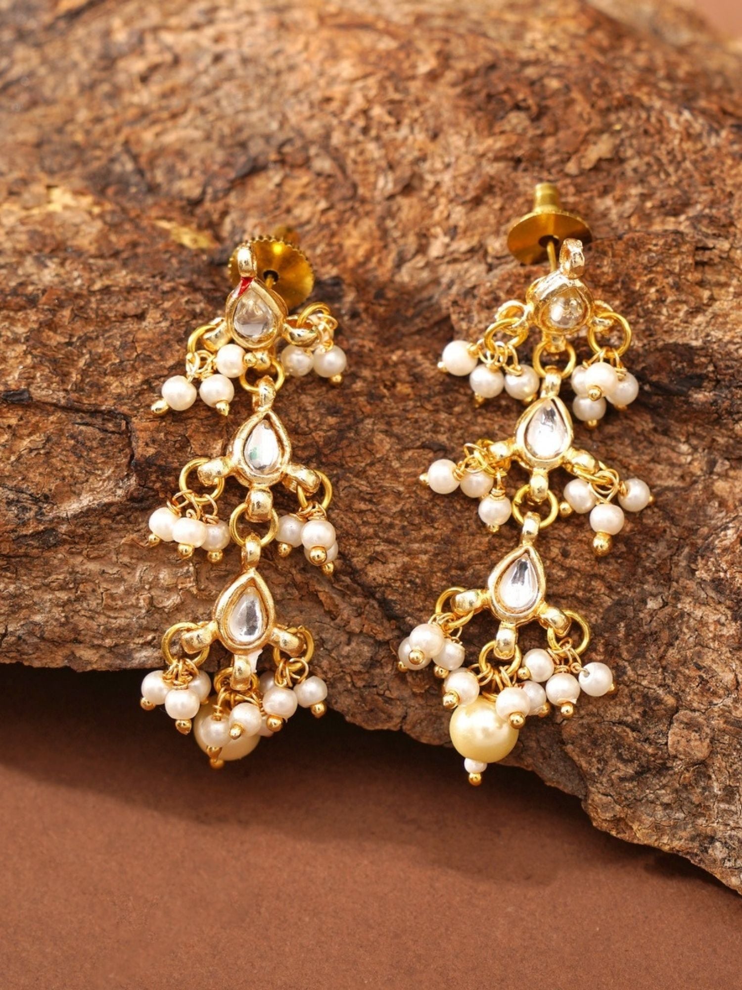 Abdesigns Jewellery Elegant Pendant Chain with Floral Design featuring gold and pearl accents on rustic background