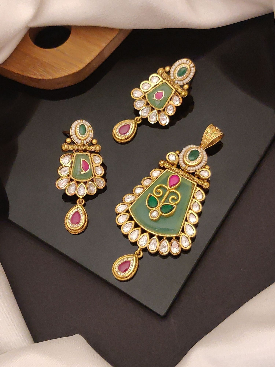 Abdesigns Jewellery Elegant Pendents Set with Stones featuring green and pink stones with gold detailing
