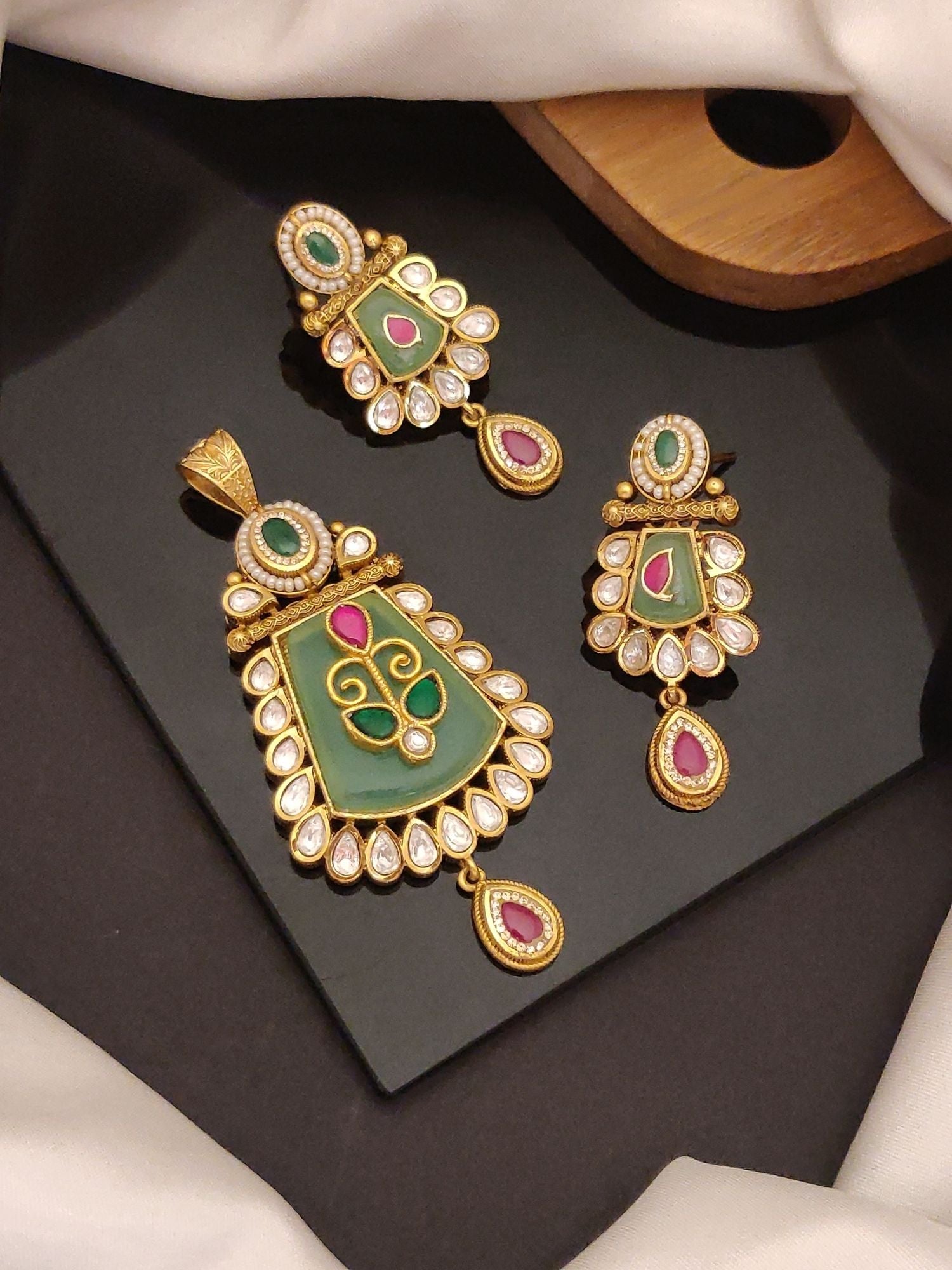 Abdesigns Jewellery Elegant Pendents Set with Stones featuring green and pink stones with gold detailing