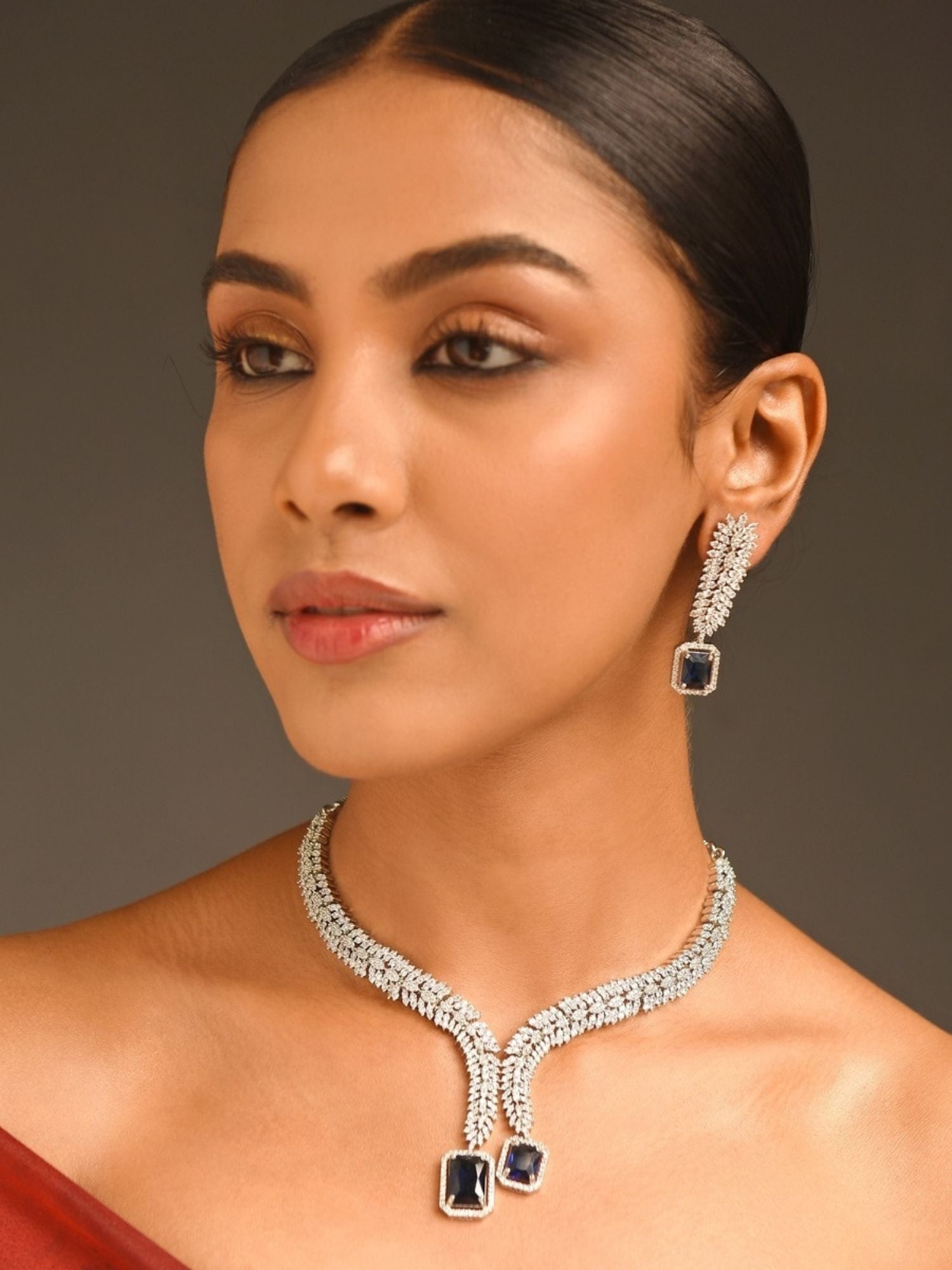 Abdesigns Jewellery Elegant Swarovski Necklace Set worn by woman with matching earrings featuring blue gemstones
