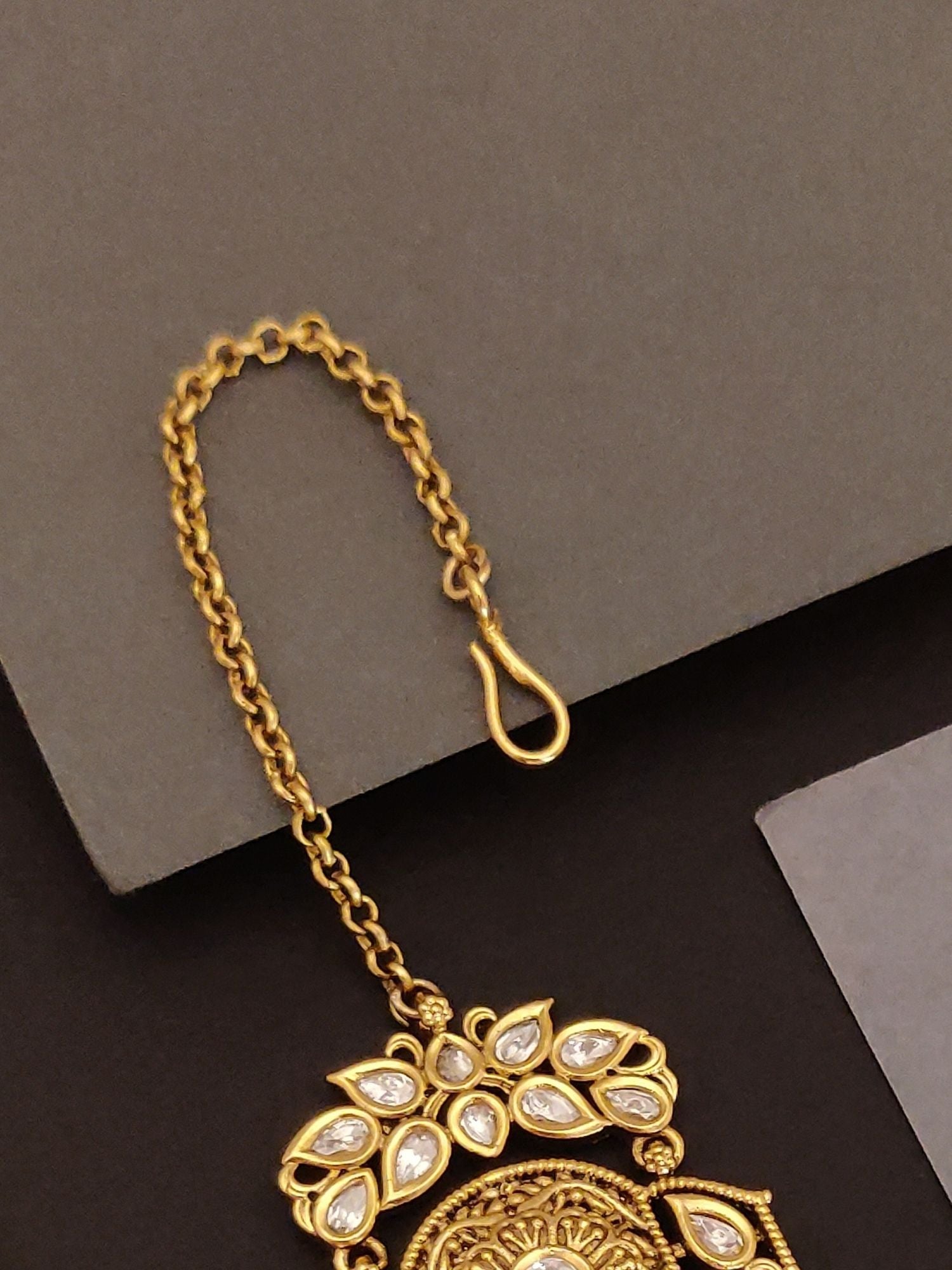 Abdesigns Jewellery Gold Pearl Maangtikka with Chain featuring intricate gold design and pearl embellishments