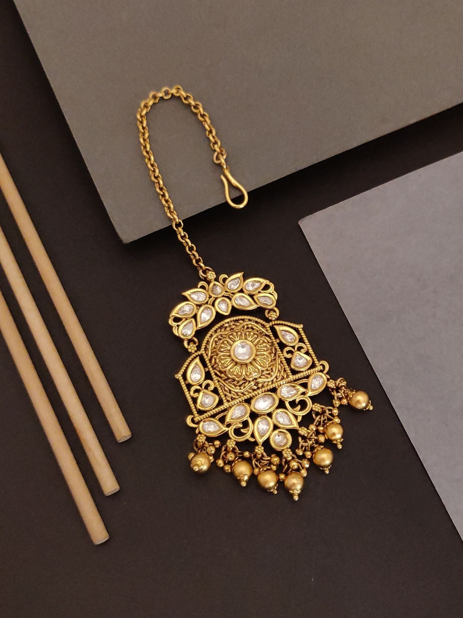 Abdesigns Jewellery Gold Pearl Maangtikka with Chain featuring intricate gold design