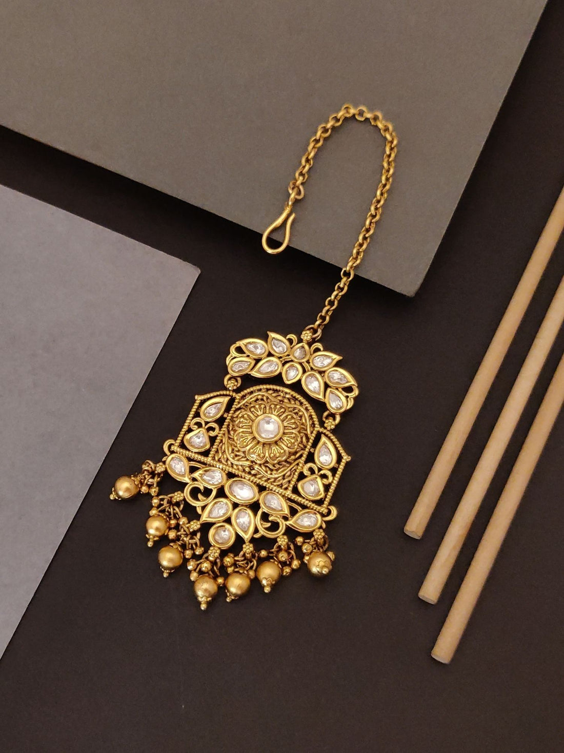 Abdesigns Jewellery Gold Pearl Maangtikka with Chain featuring intricate design and pearl accents