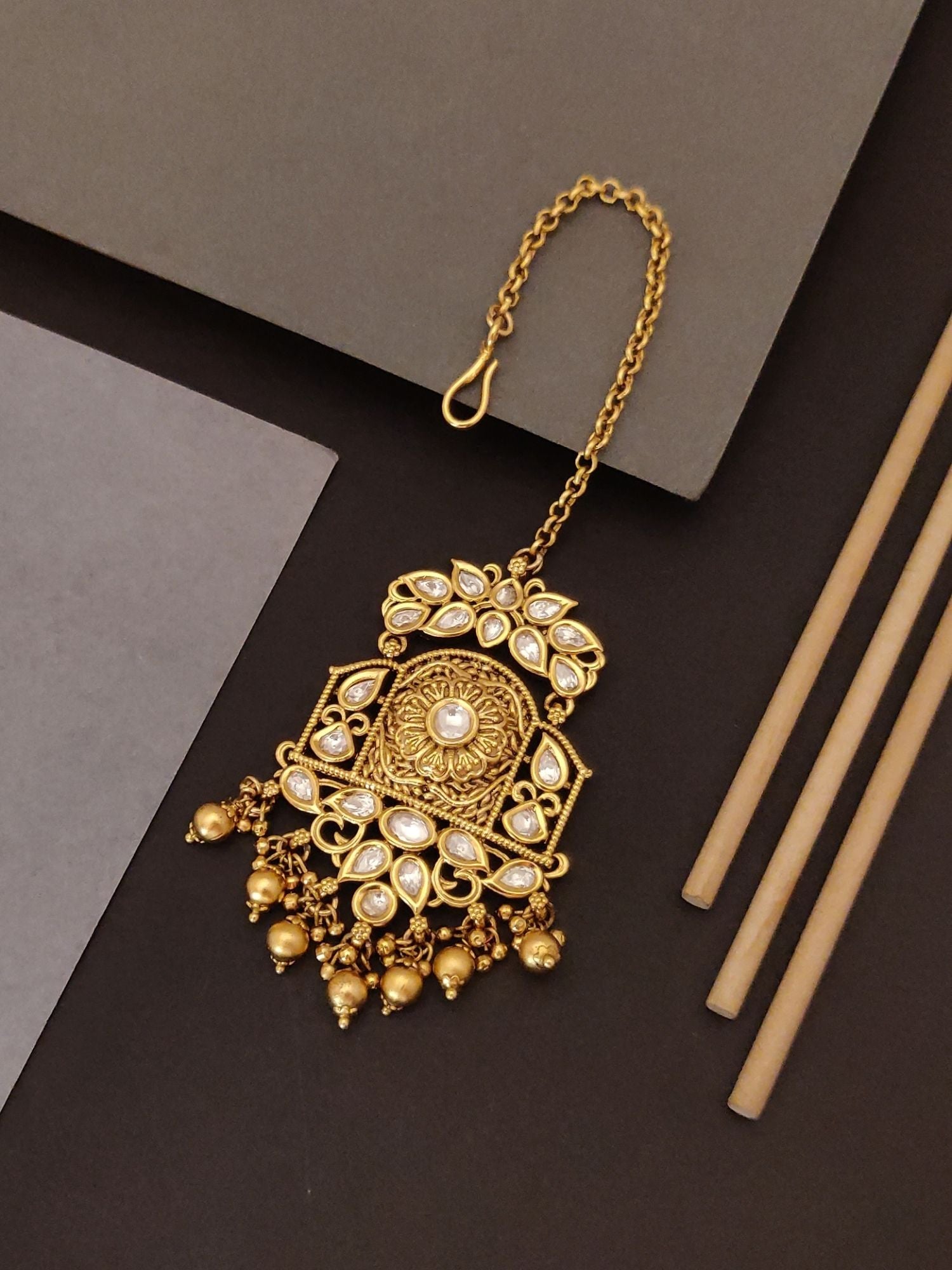 Abdesigns Jewellery Gold Pearl Maangtikka with Chain featuring intricate design and pearl accents