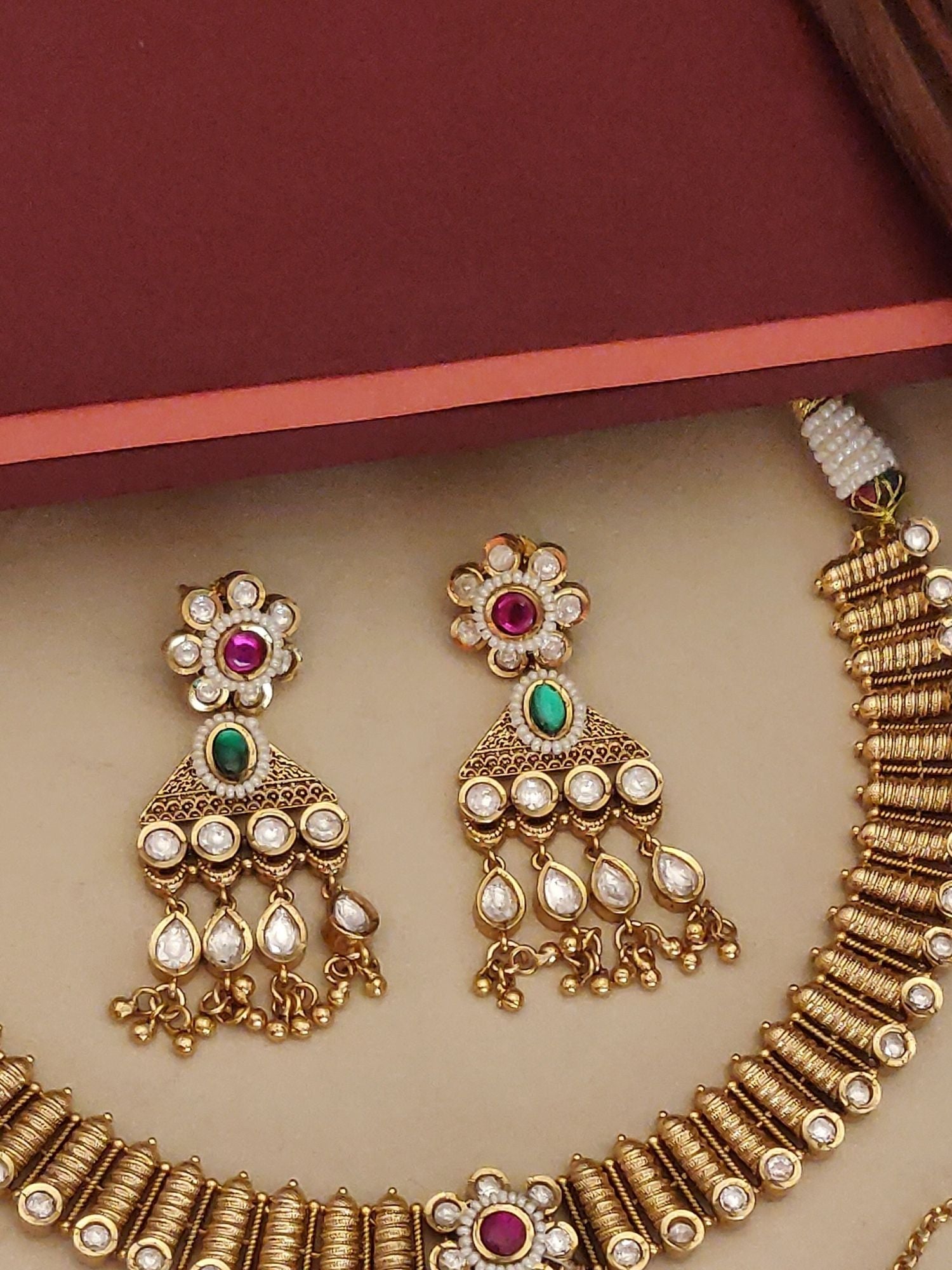 Abdesigns Jewellery Gold Pearl Pendant Necklace Set with intricate gold design and matching earrings featuring pearls and colored stones