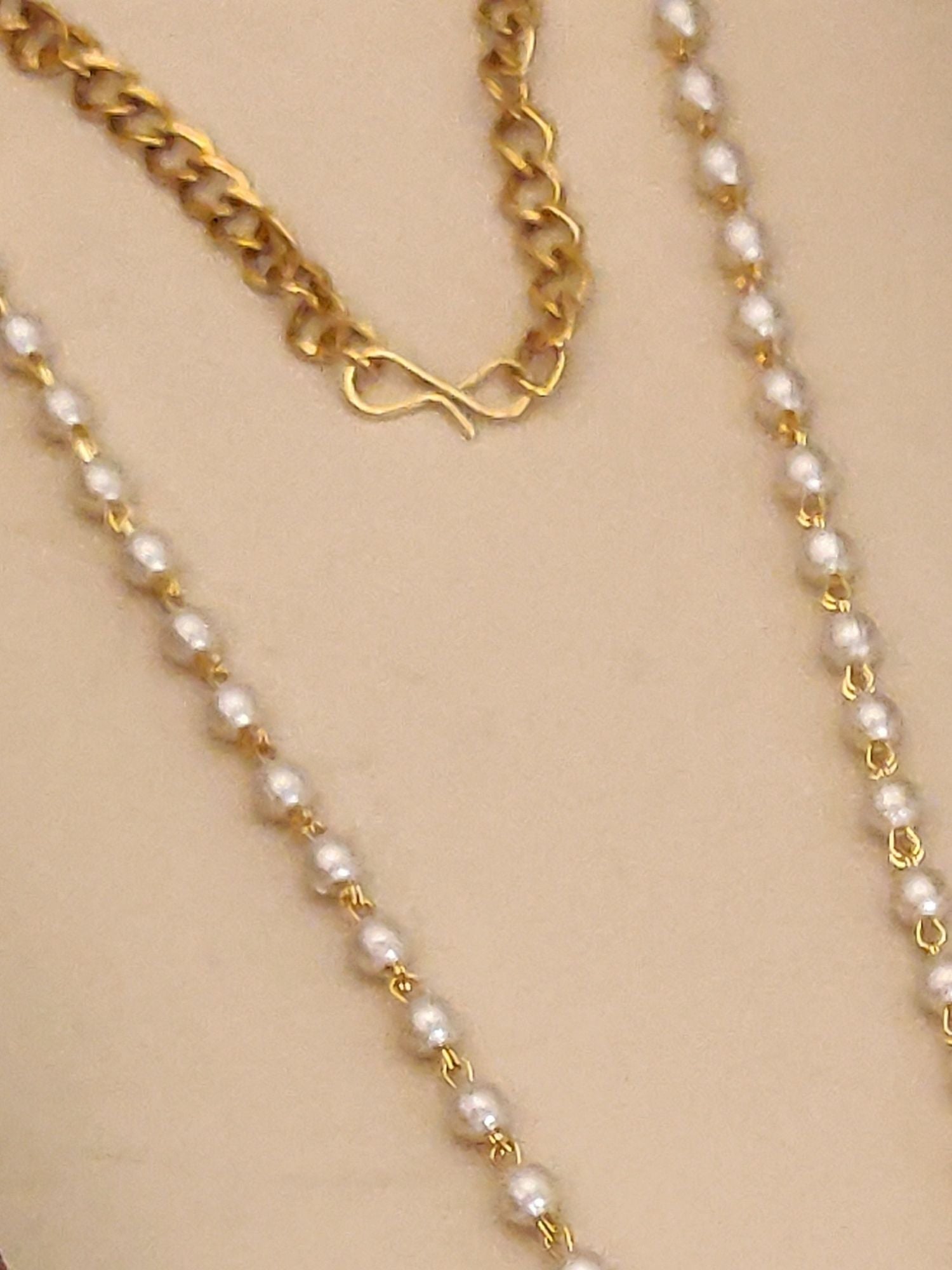 Close-up of Abdesigns Jewellery Gold Pendant Chain with Earrings Set featuring gold links and pearls