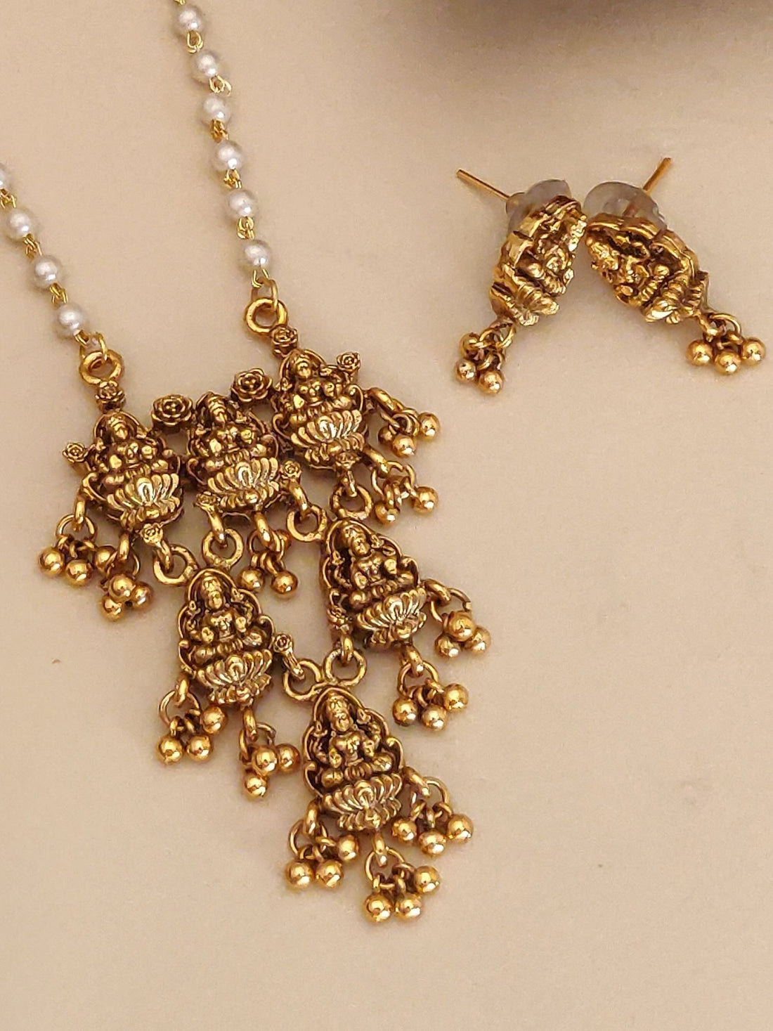 Abdesigns Jewellery Gold Pendant Chain with Earrings Set featuring intricate gold floral design and pearl accents