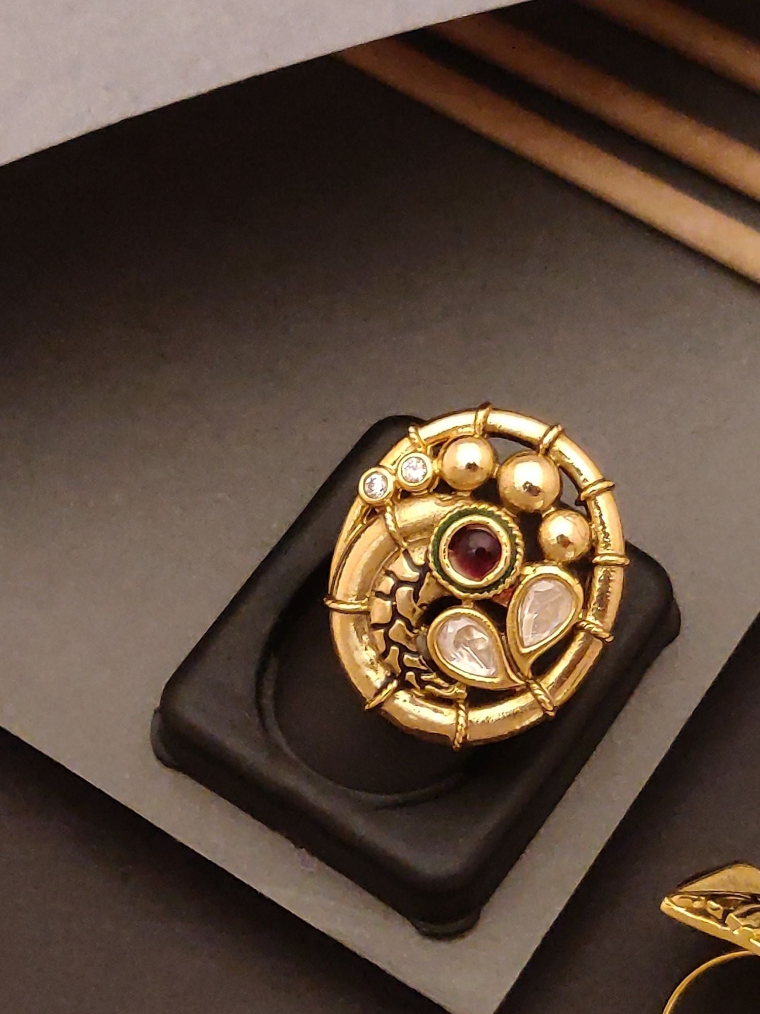 Abdesigns Jewellery Gold-Plated Elegant Designer Ring with red and white stones in intricate circular design