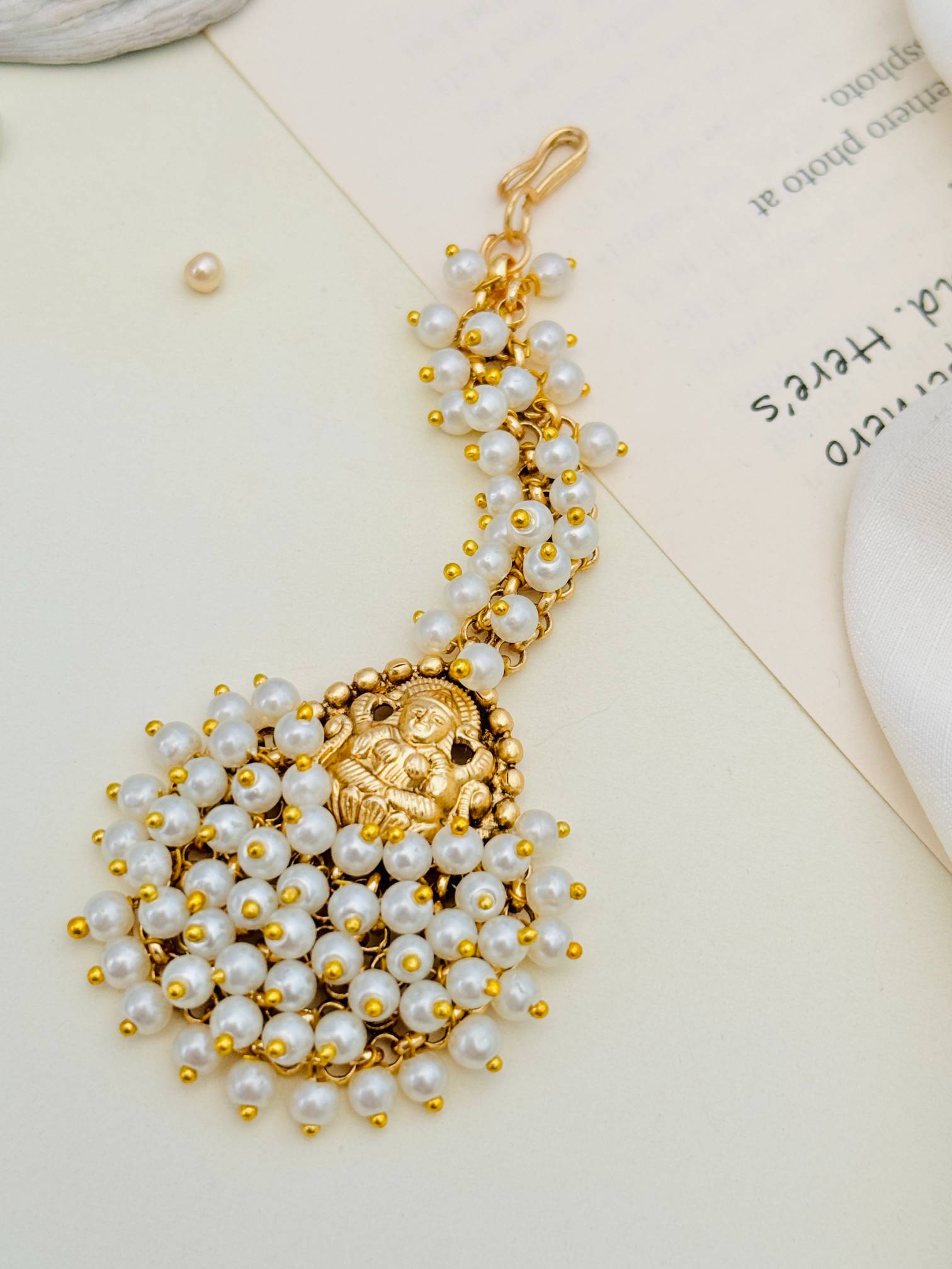 Abdesigns Jewellery Gold Plated Pearl Maangtikka for Traditional Look with intricate gold design and pearl beads