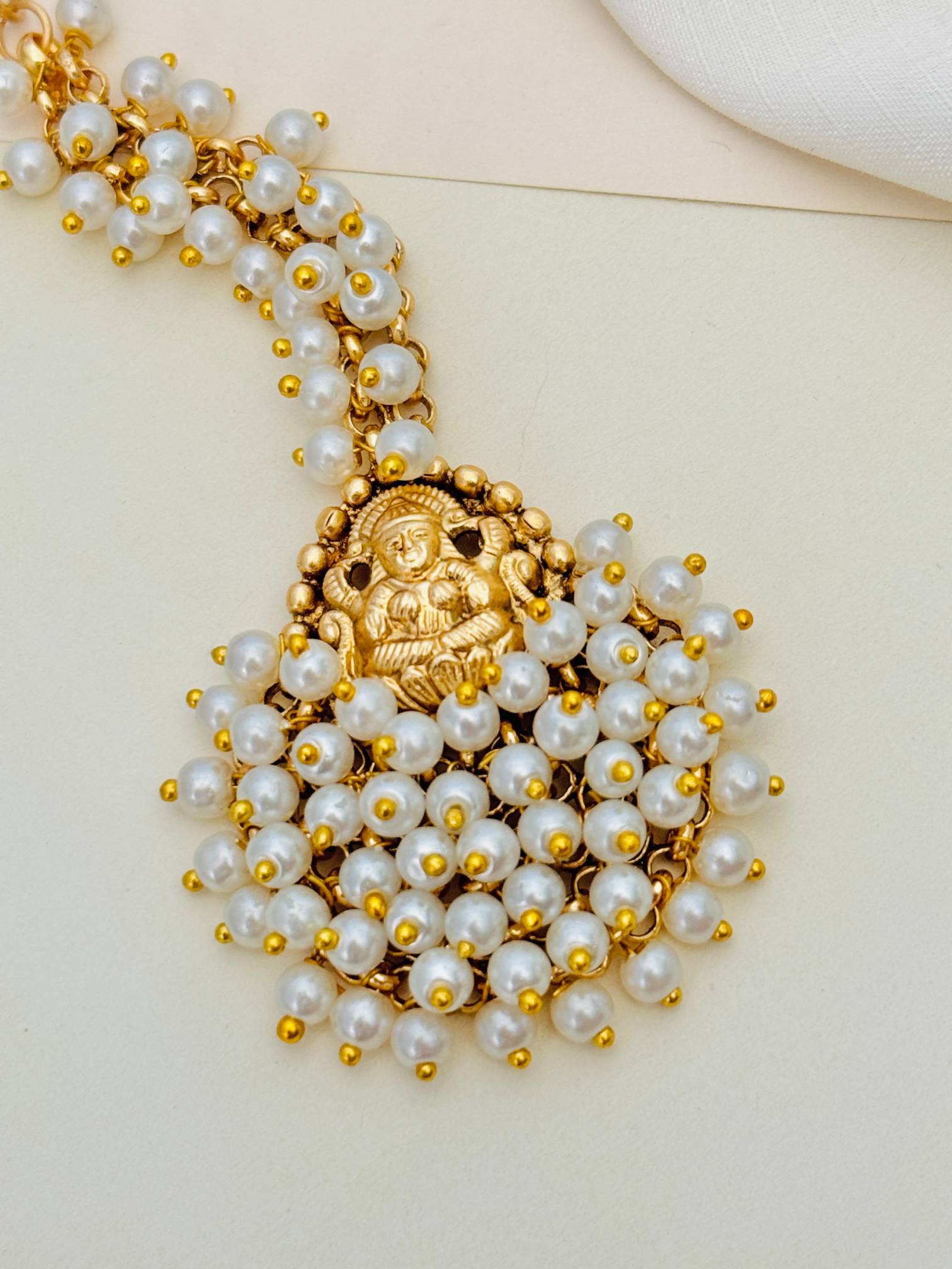 Abdesigns Jewellery Gold Plated Pearl Maangtikka for Traditional Look with intricate pearl design and gold plating