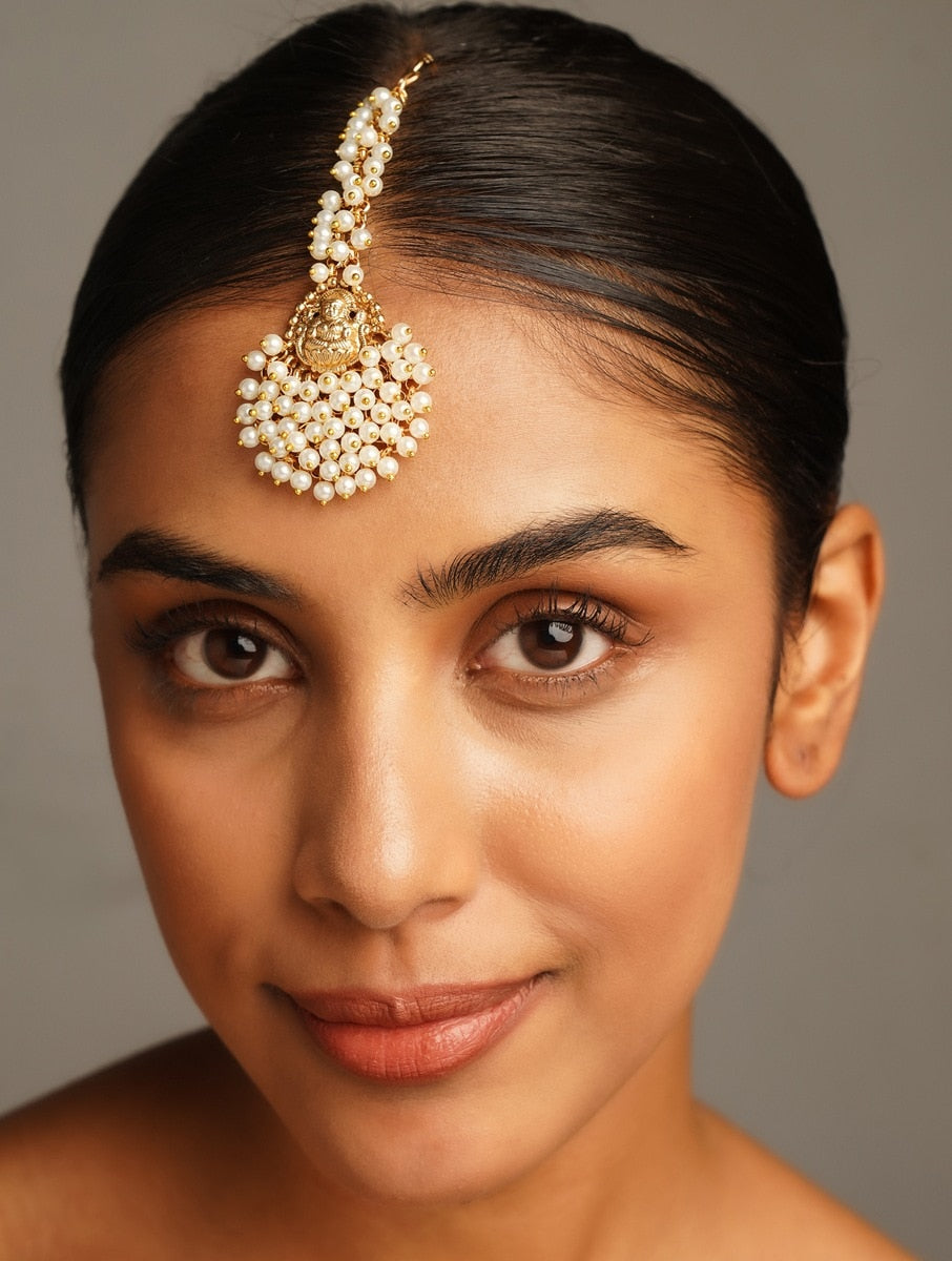 Abdesigns Jewellery Gold Plated Pearl Maangtikka for Traditional Look worn by a woman