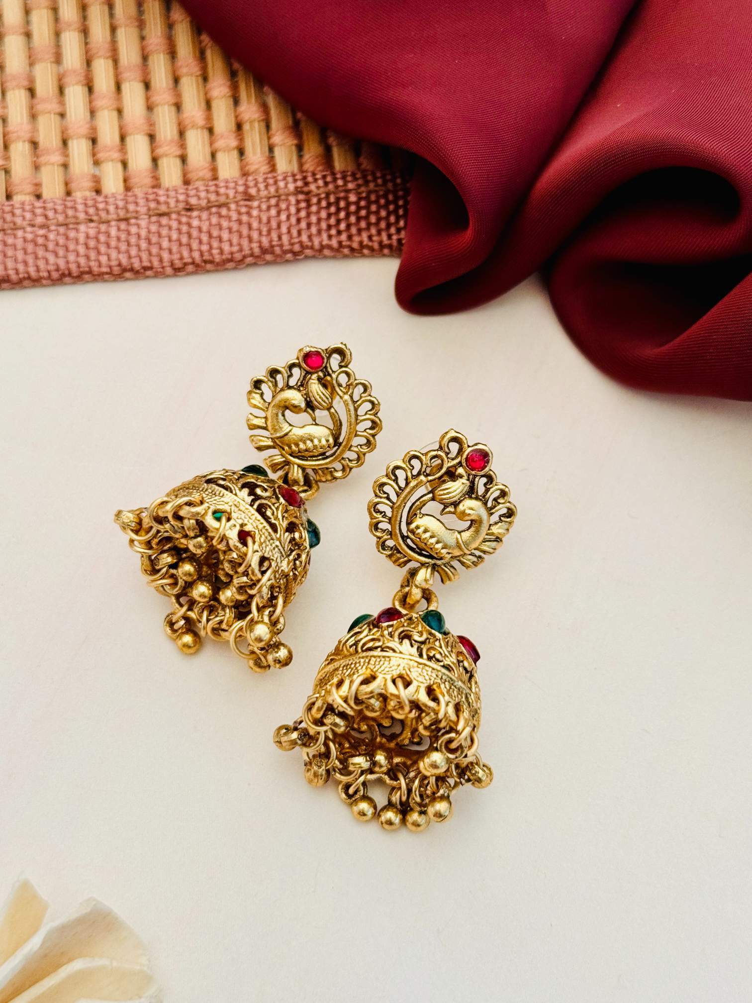Abdesigns Jewellery Gold-Tone Traditional Necklace Set featuring intricate gold-tone jhumka earrings with red and green accents