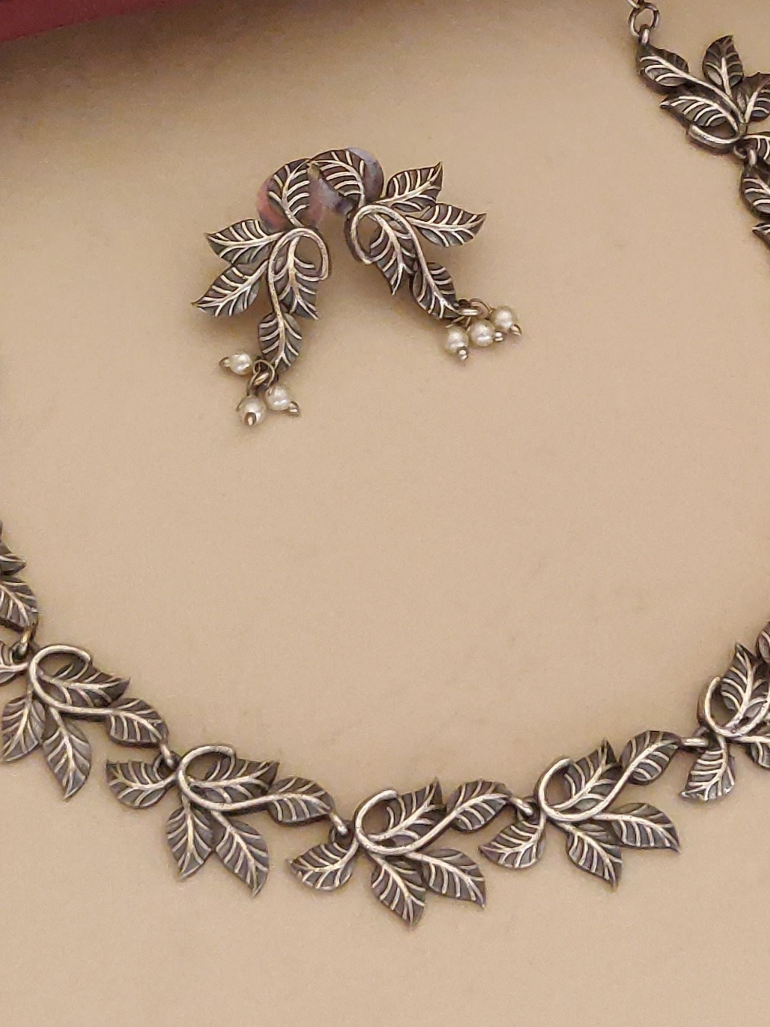 Abdesigns Jewellery Leaf Pattern Silver Necklace Set with matching earrings featuring detailed leaf design and pearl accents
