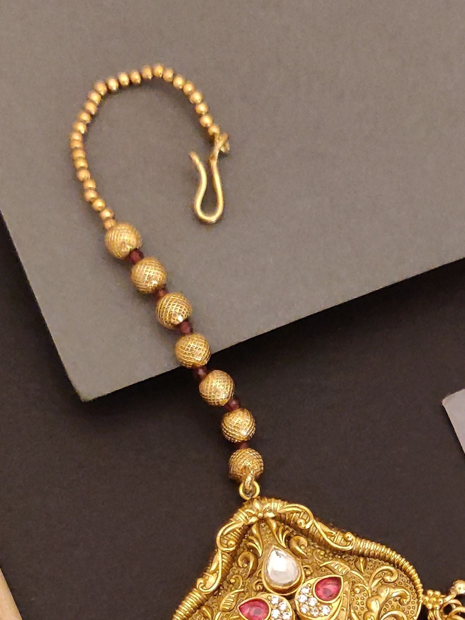 Abdesigns Jewellery Maangtikka - Elegant Gold-Tone Design with intricate beads and gemstones