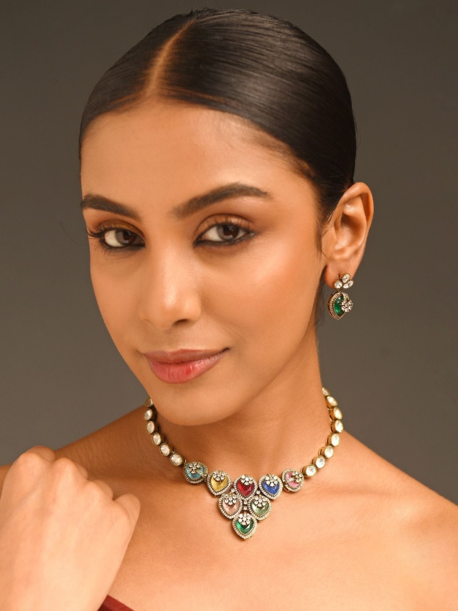 Abdesigns Jewellery Multicolor Heart Pendant Necklace worn by a woman with matching earrings