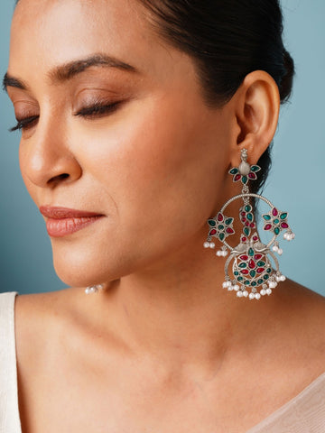 Abdesigns Jewellery Pearl Drop Earrings with Floral Design worn by woman showcasing intricate green and red floral patterns
