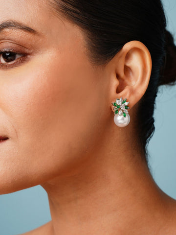 Close-up of a woman wearing Abdesigns Jewellery Pearl & Green Leaf Earrings with pearl drop and green leaf accents