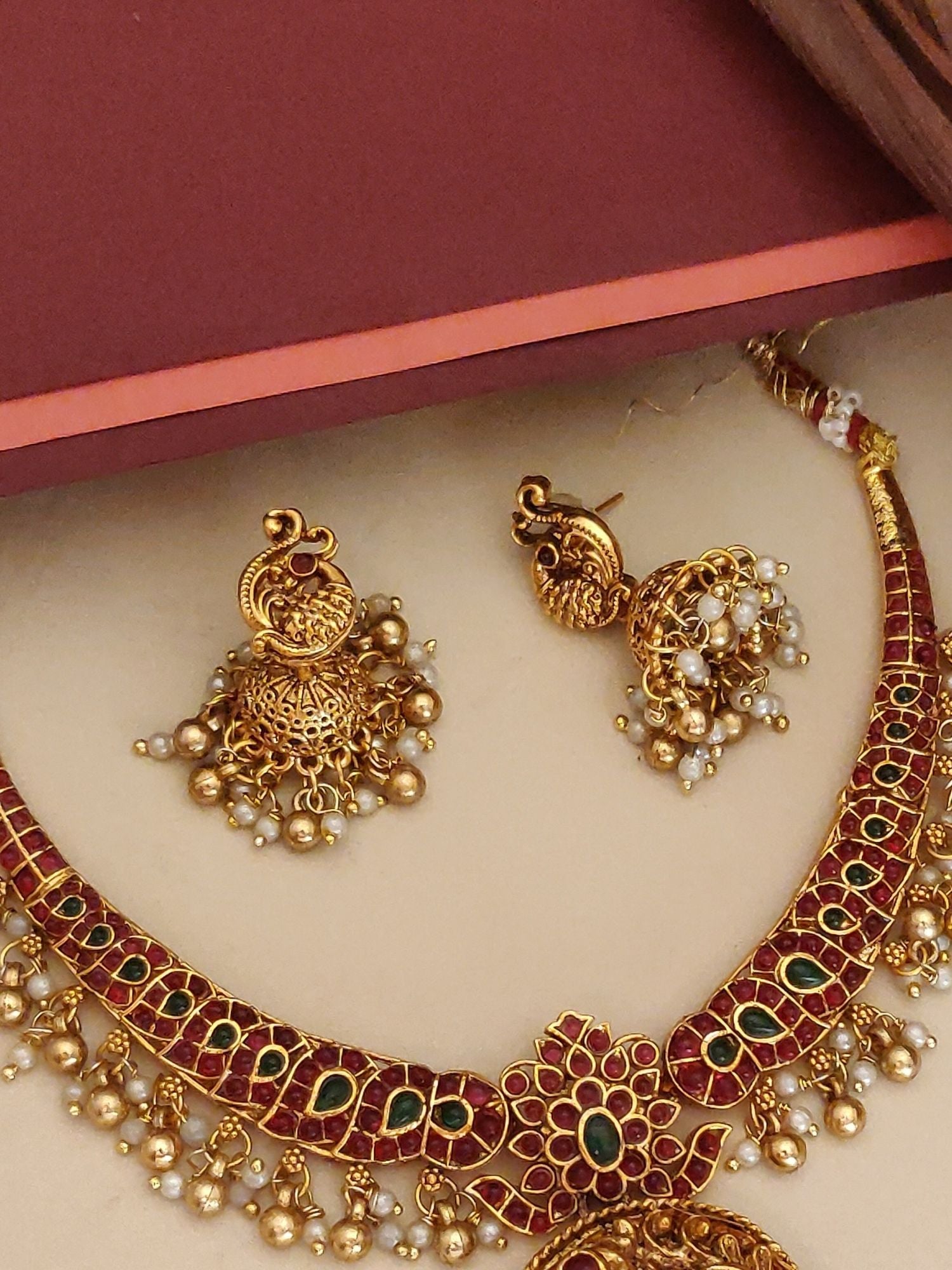 Abdesigns Jewellery Pendant Chain Set with Earrings featuring gold finish green and red stones with pearl accents