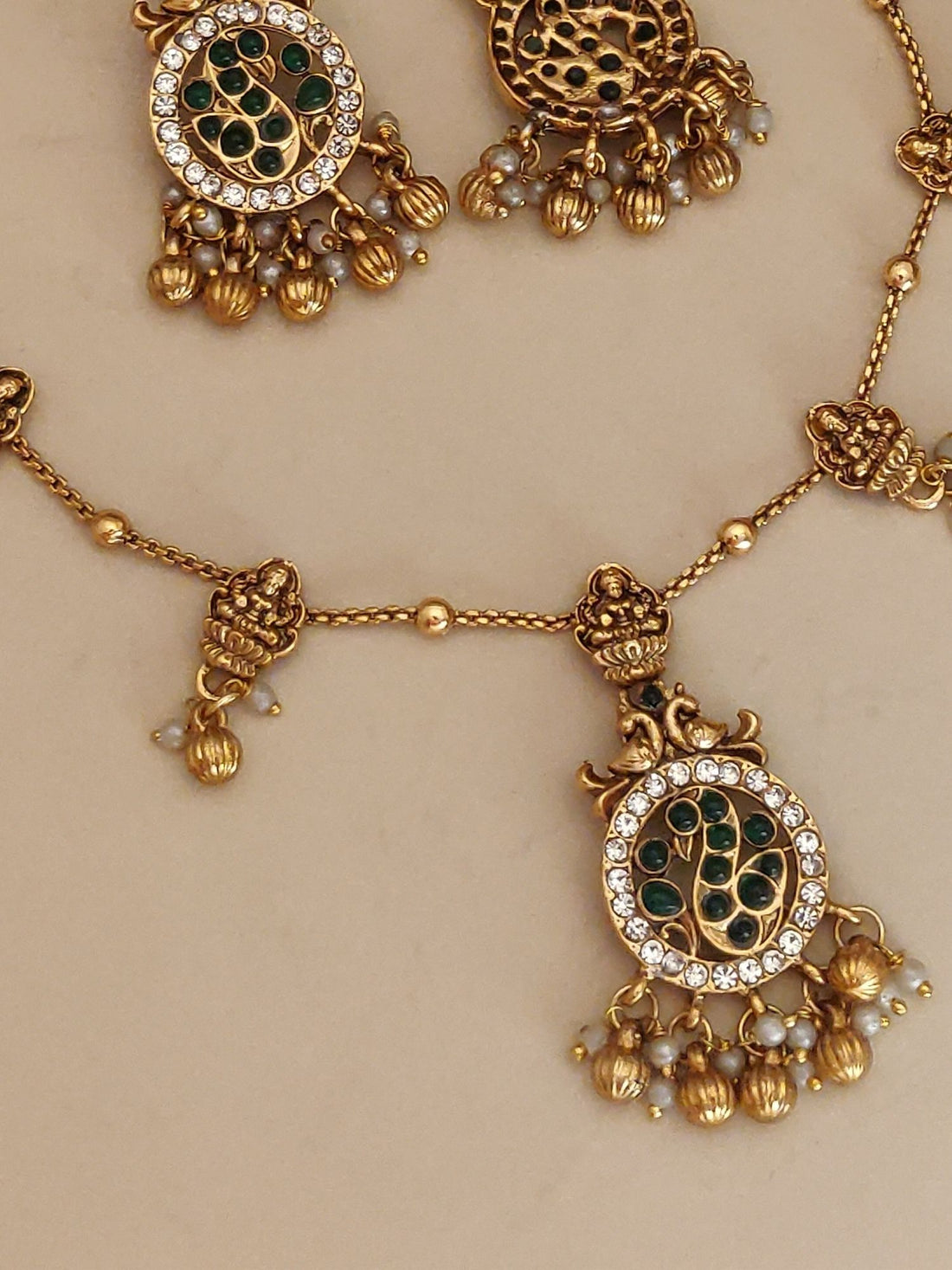 Abdesigns Jewellery Pendents Chain with Antique Gold Finish featuring intricate green and white stone detailing and elegant dangle design