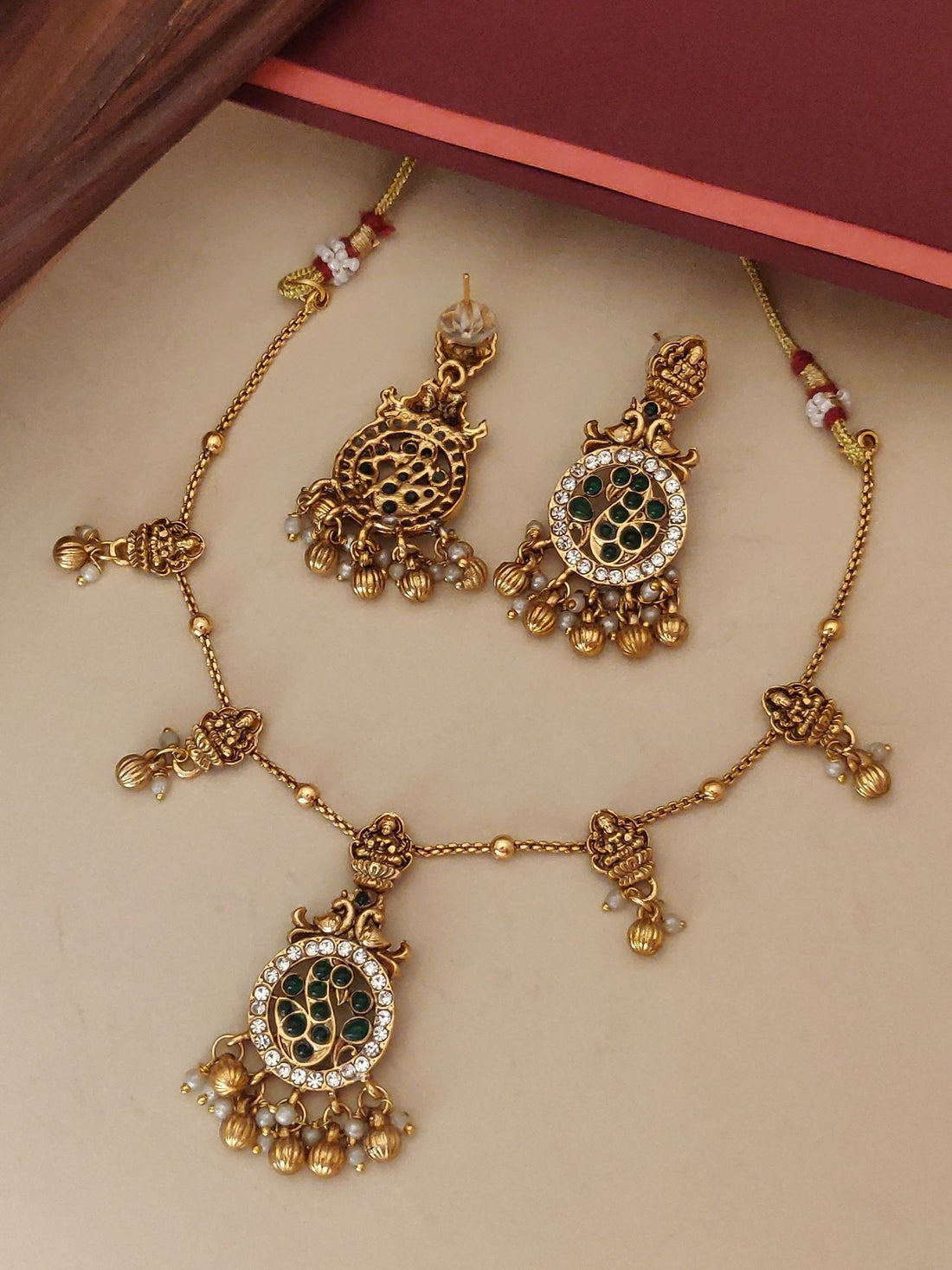 Abdesigns Jewellery Pendents Chain with Antique Gold Finish featuring intricate green and white stone detailing and elegant dangle design